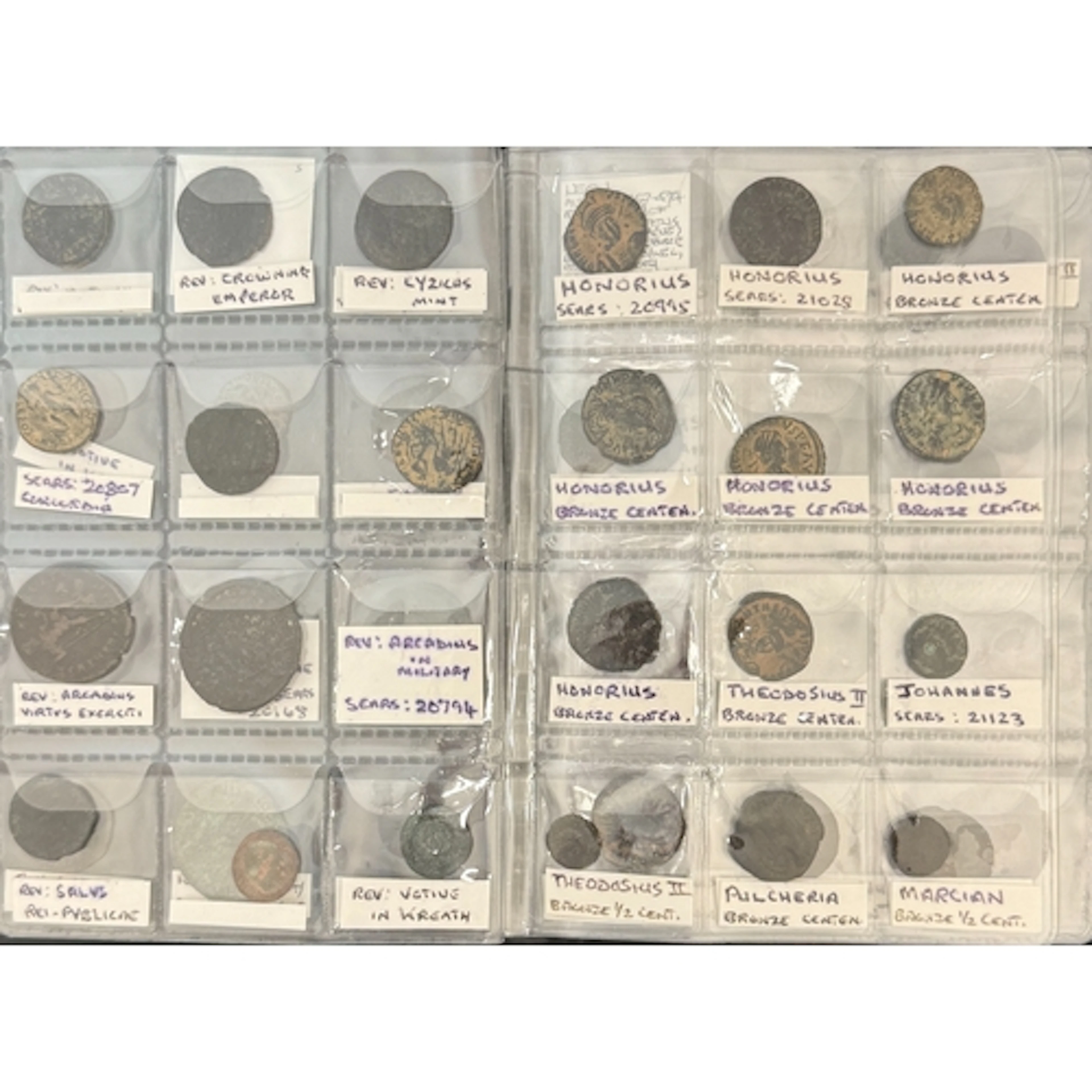 A coin album containing 74 Roman bronze coins, noted Valenti...