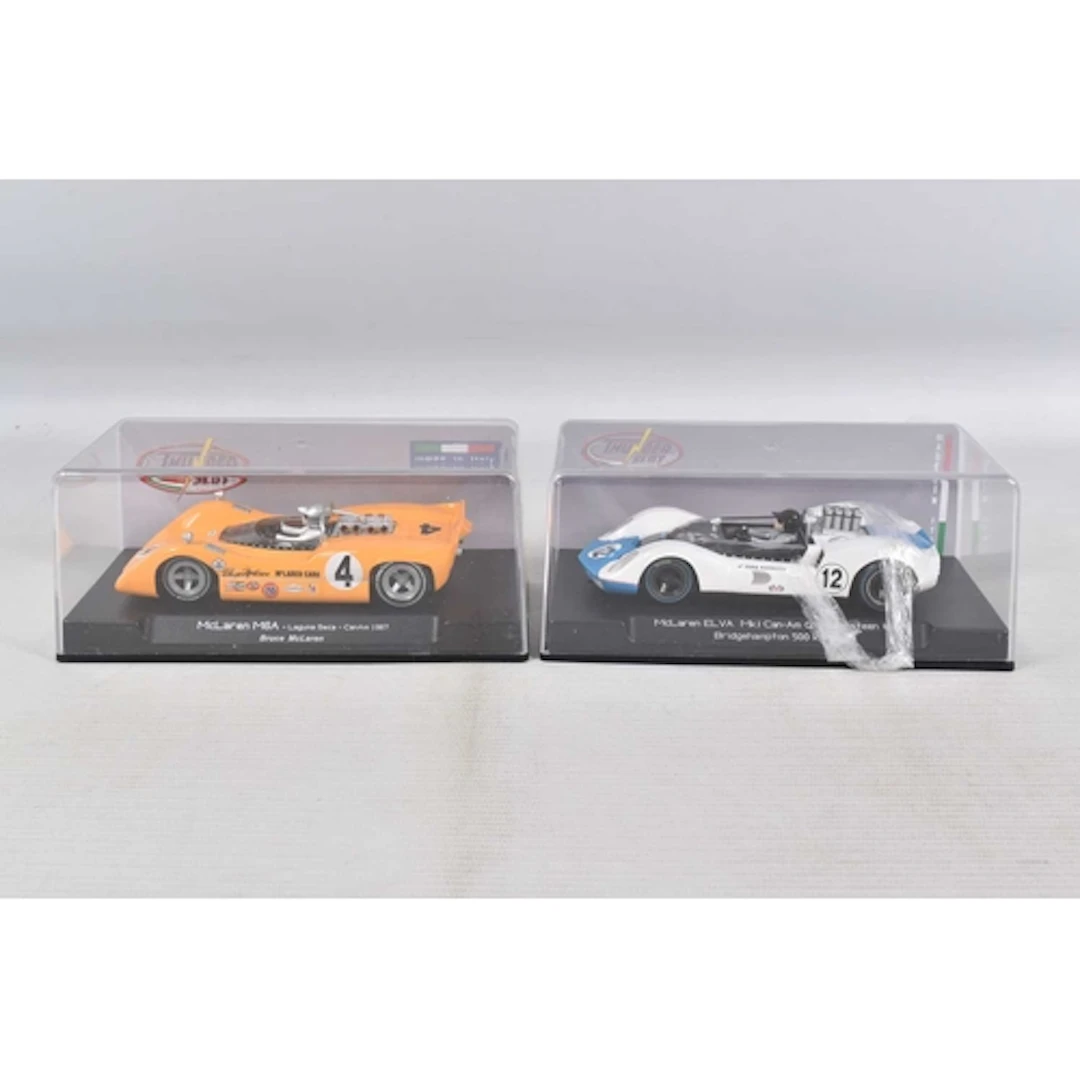 TWO CASED THUNDER SLOT MODEL SLOT CARS, to include a McLaren...