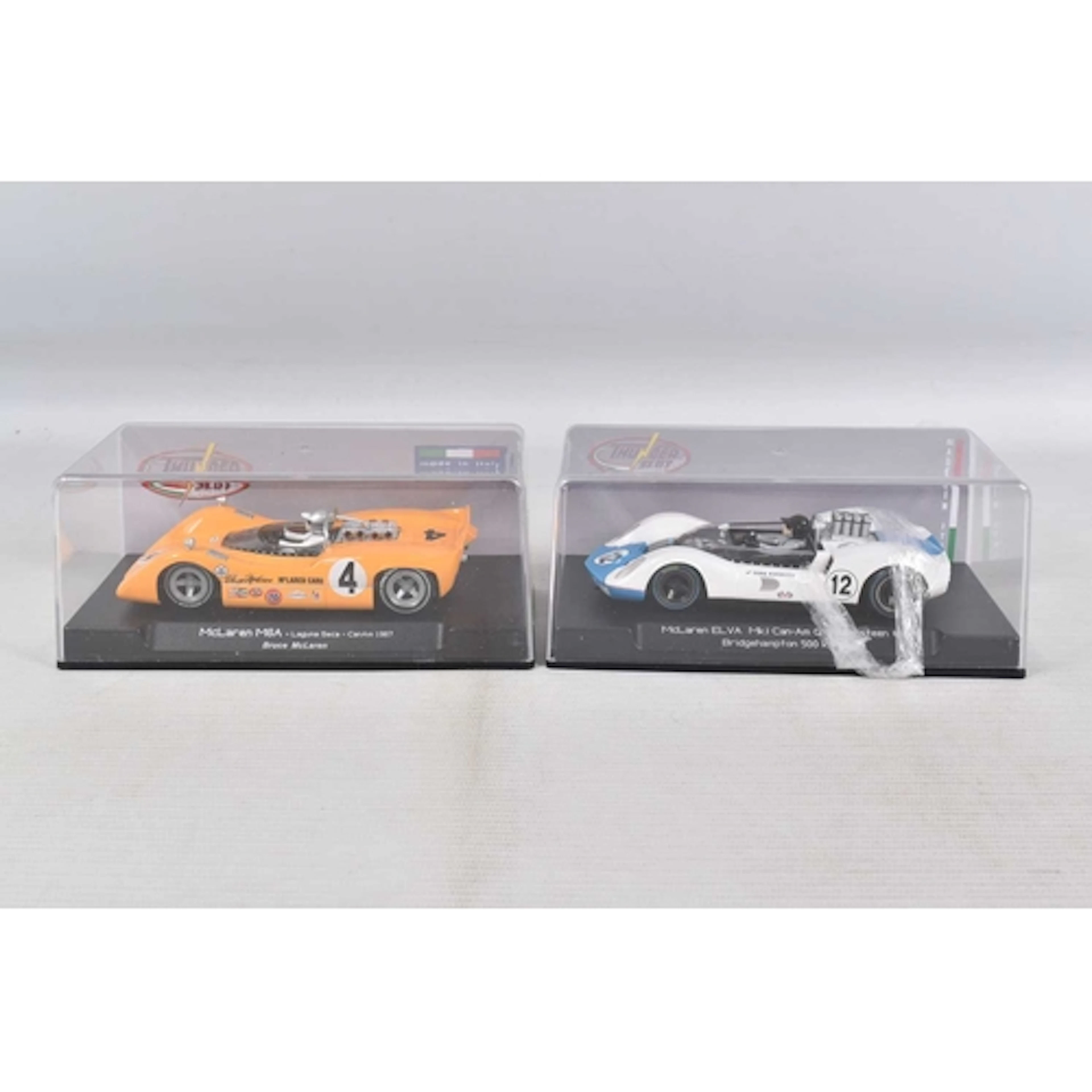 TWO CASED THUNDER SLOT MODEL SLOT CARS, to include a McLaren...