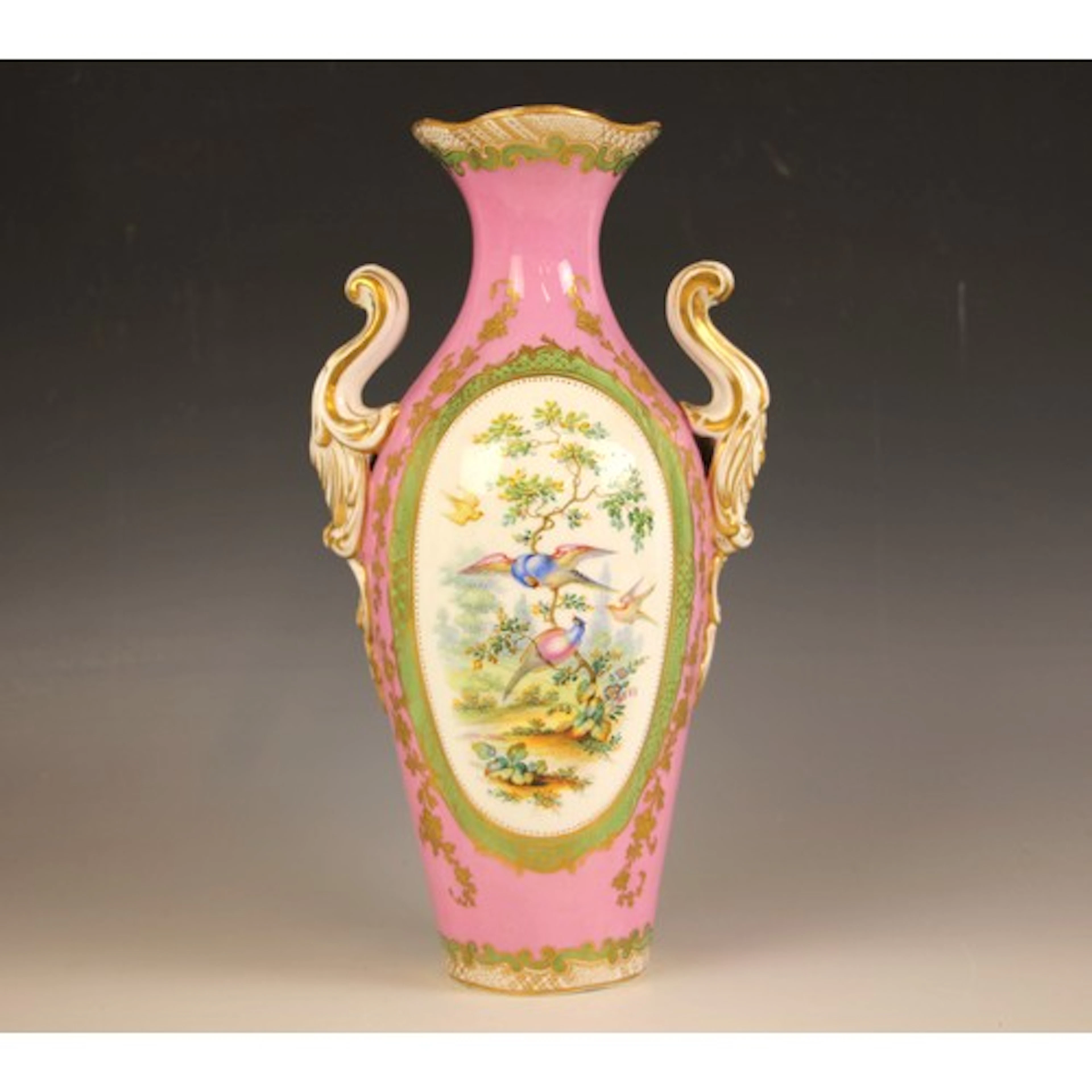 A French porcelain rococo style vase in the manner of Sevres...