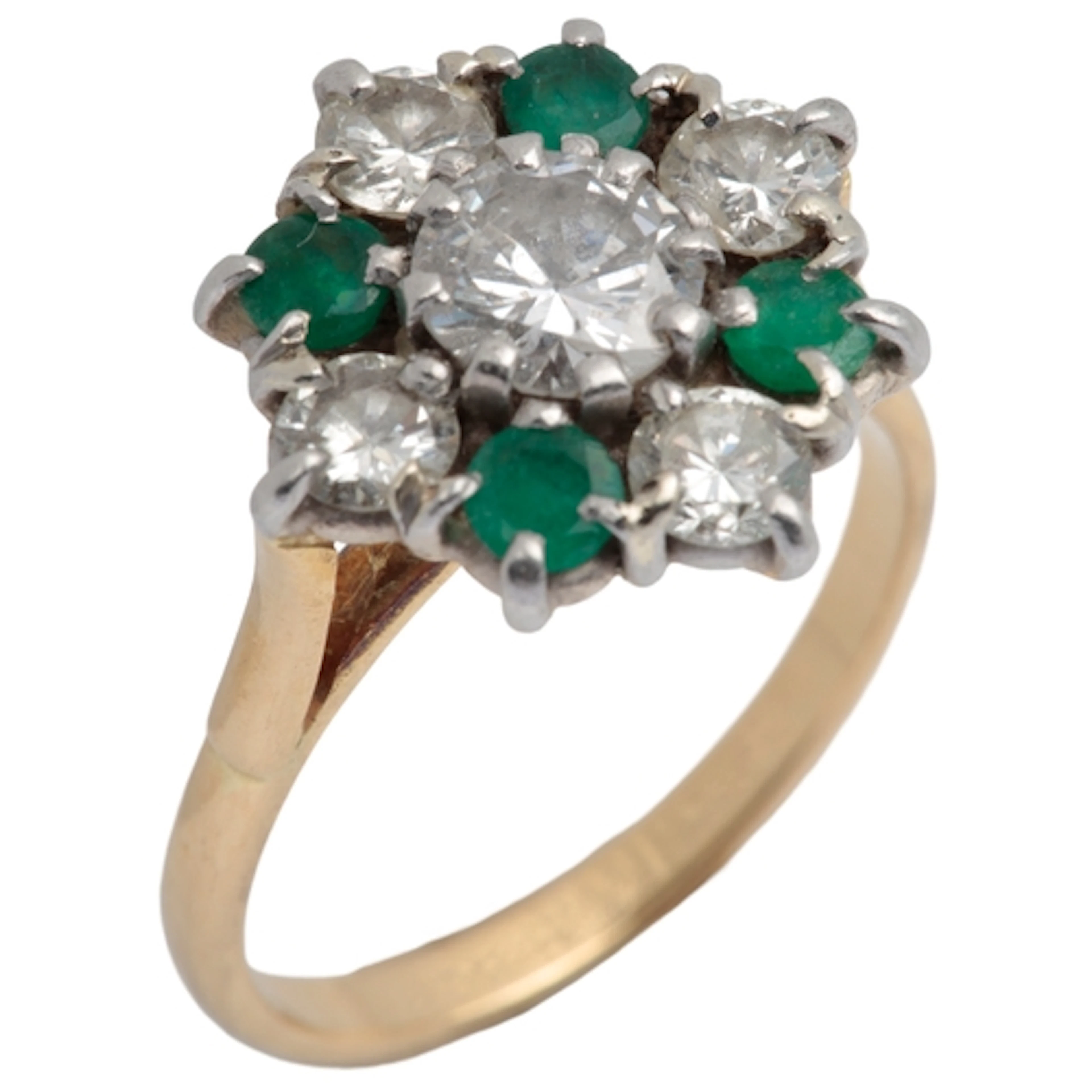 A diamond and emerald cluster ring, centring on a brilliant-...