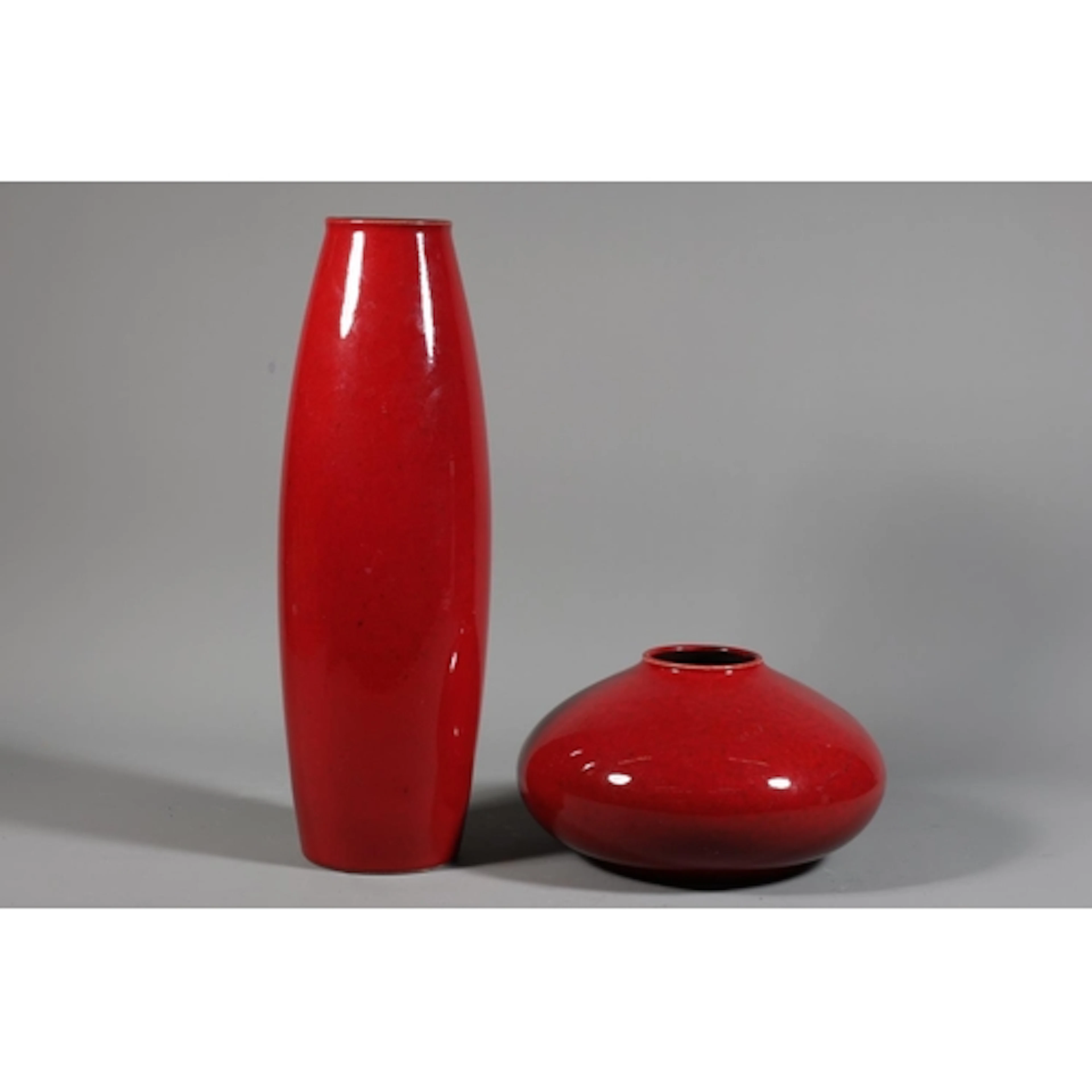 Burgundy tall vase and a burgundy squat vase. (2)