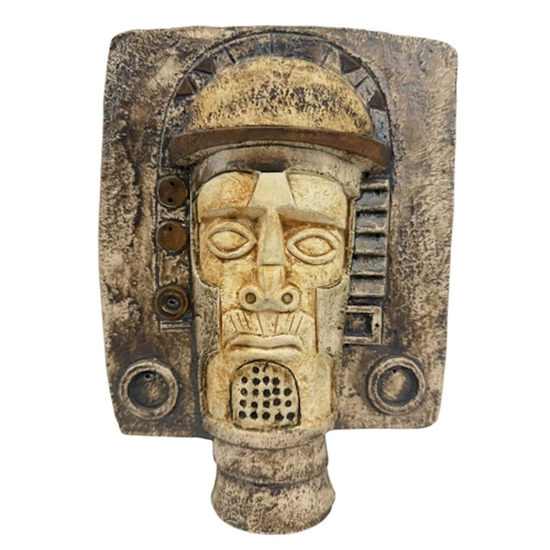 A Troika Pottery Aztec double sided face mask. The mask bein...