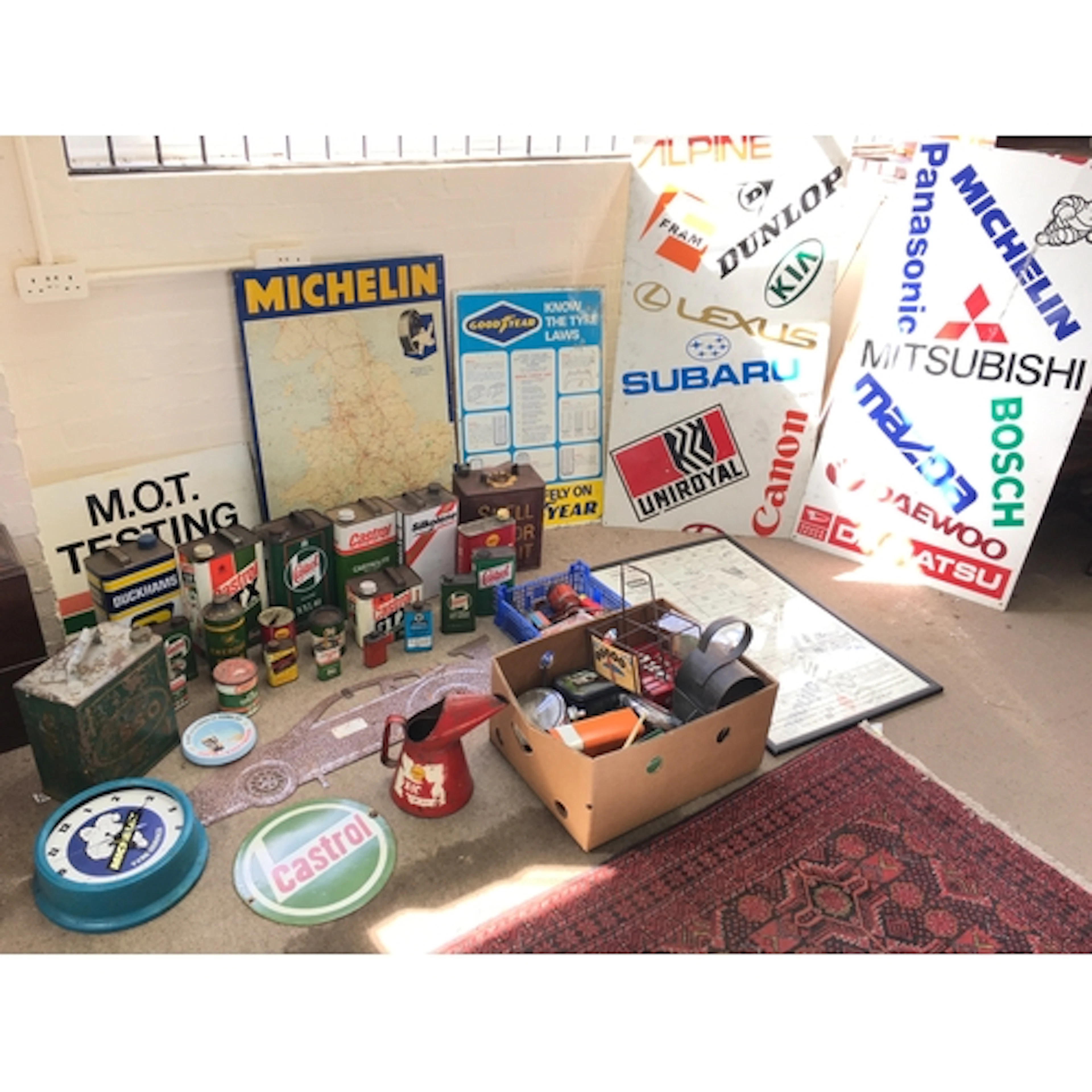 A quantity of vintage Automobile enamel signs, oil cans, tin...