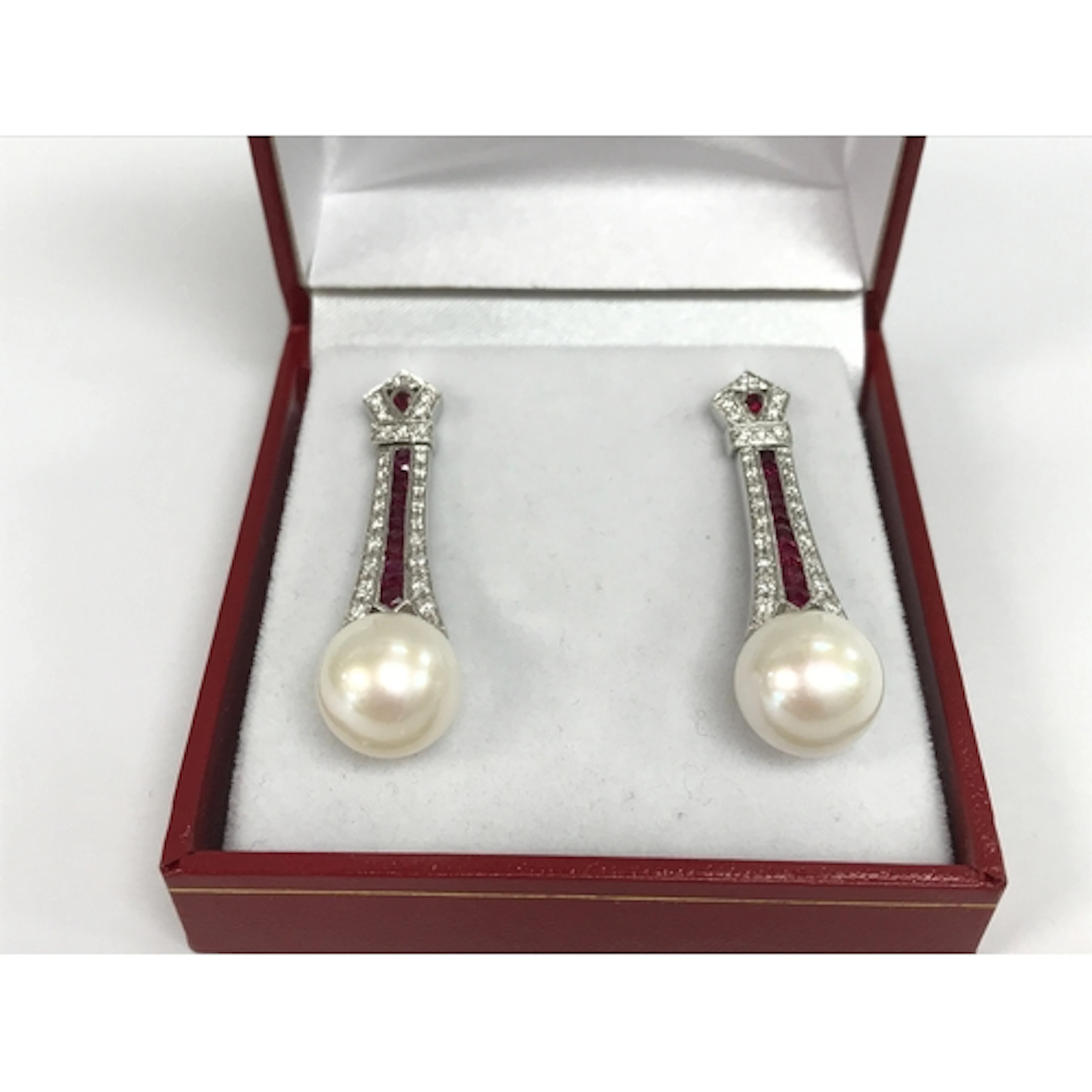 Pair of 18ct white gold art deco style drop earrings set wit...