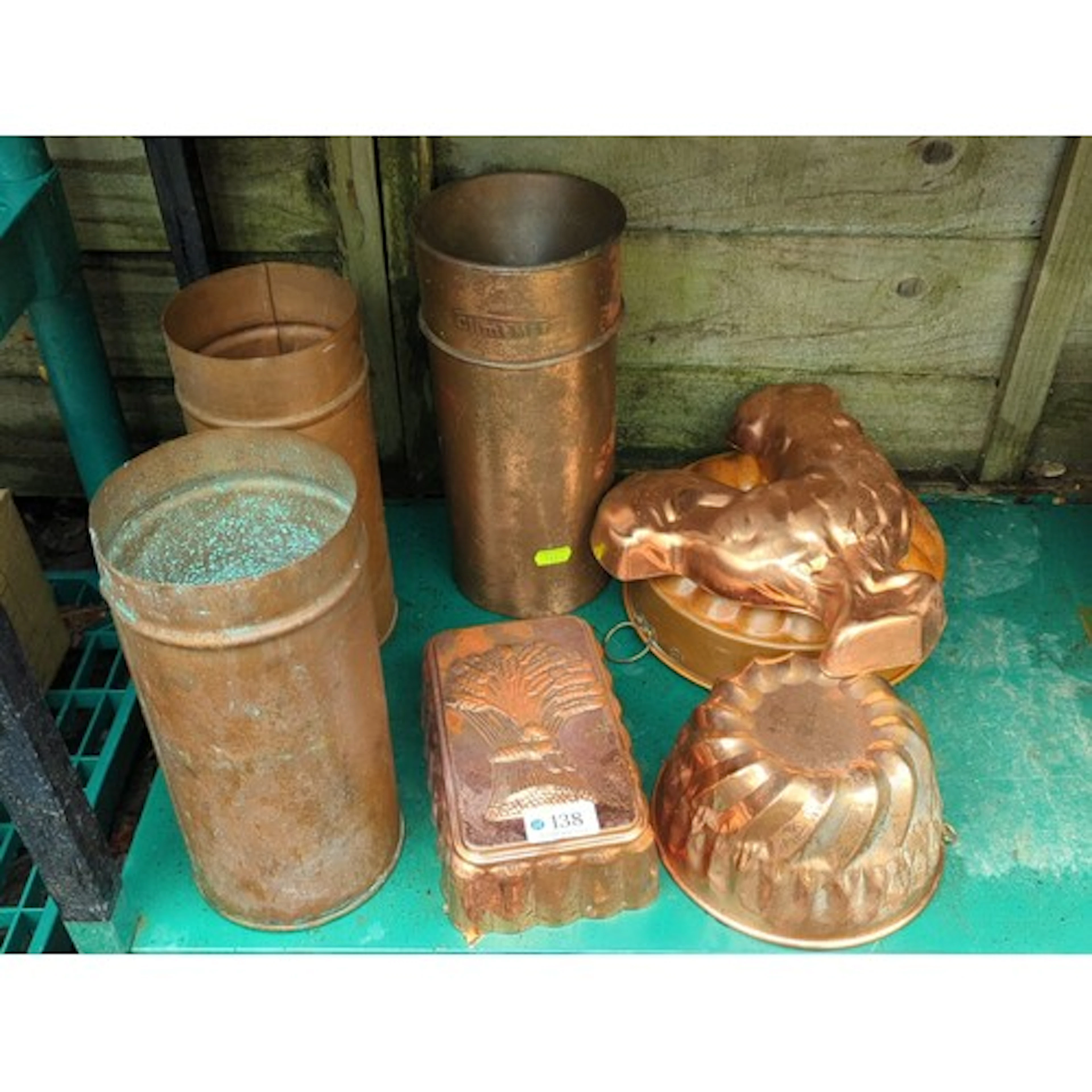 A group of copper kitchenwares comprising cylindrical storag...