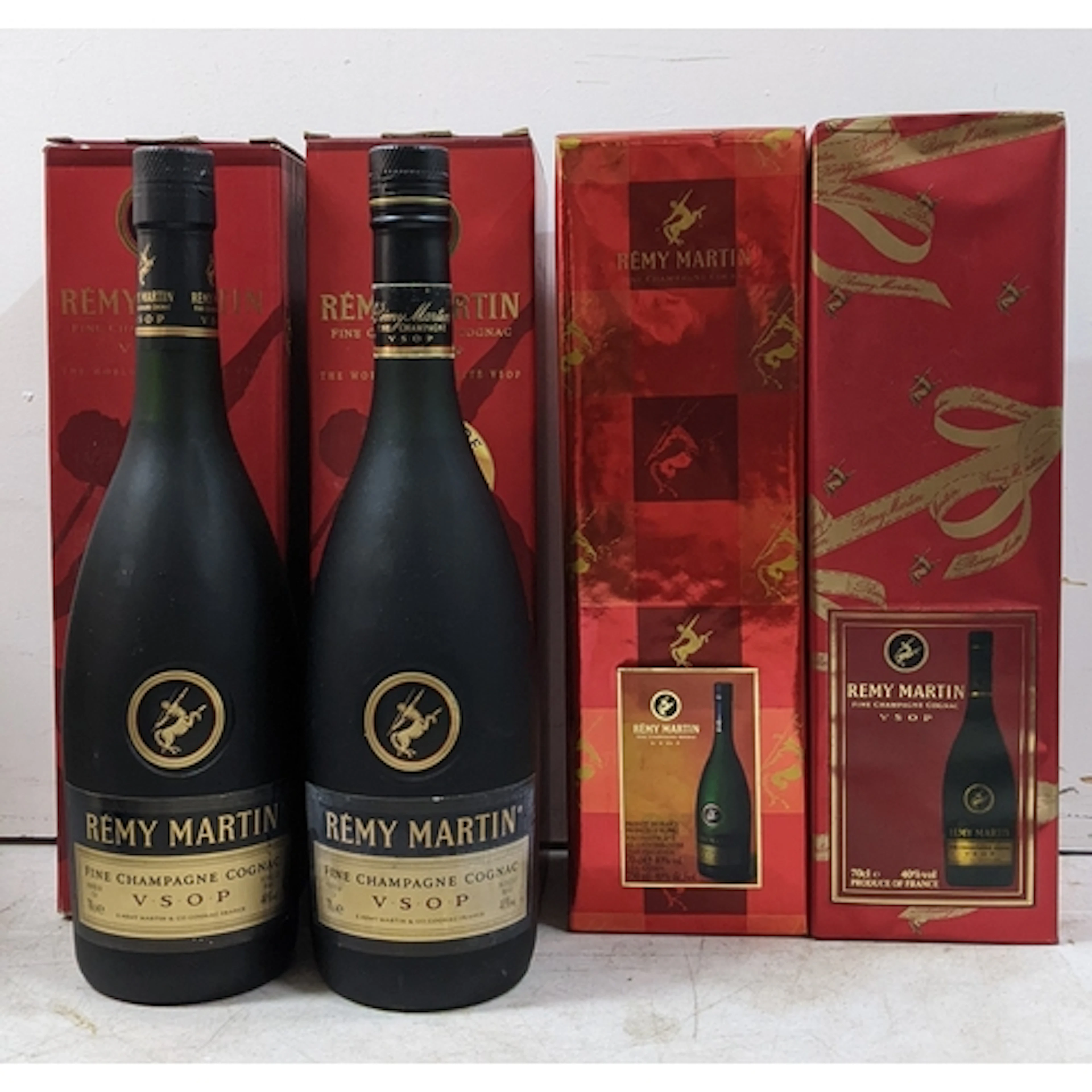 A group of four bottles of Rémy Martin VSOP Fine Champagne C...