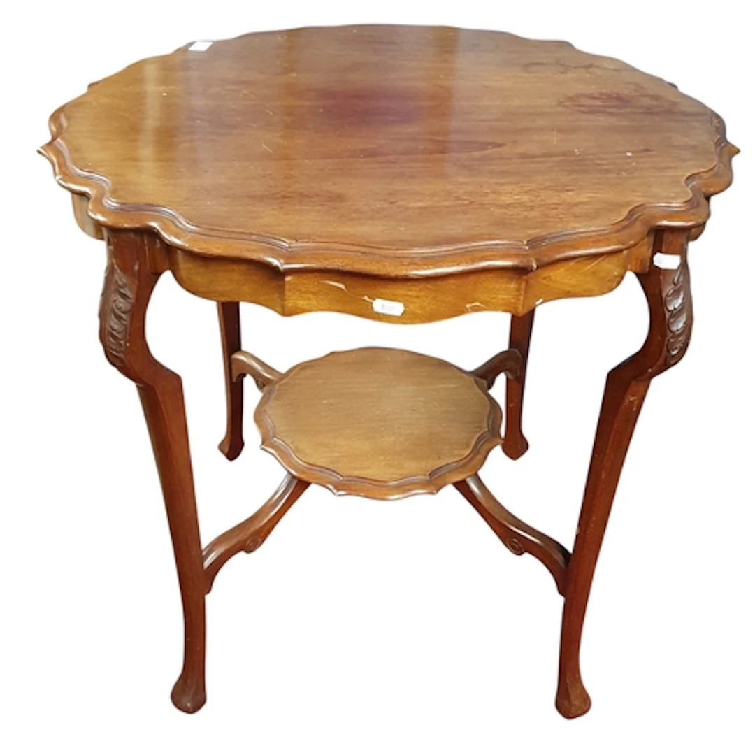 An Edwardian Mahogany scalloped edge Centre Table with carve...