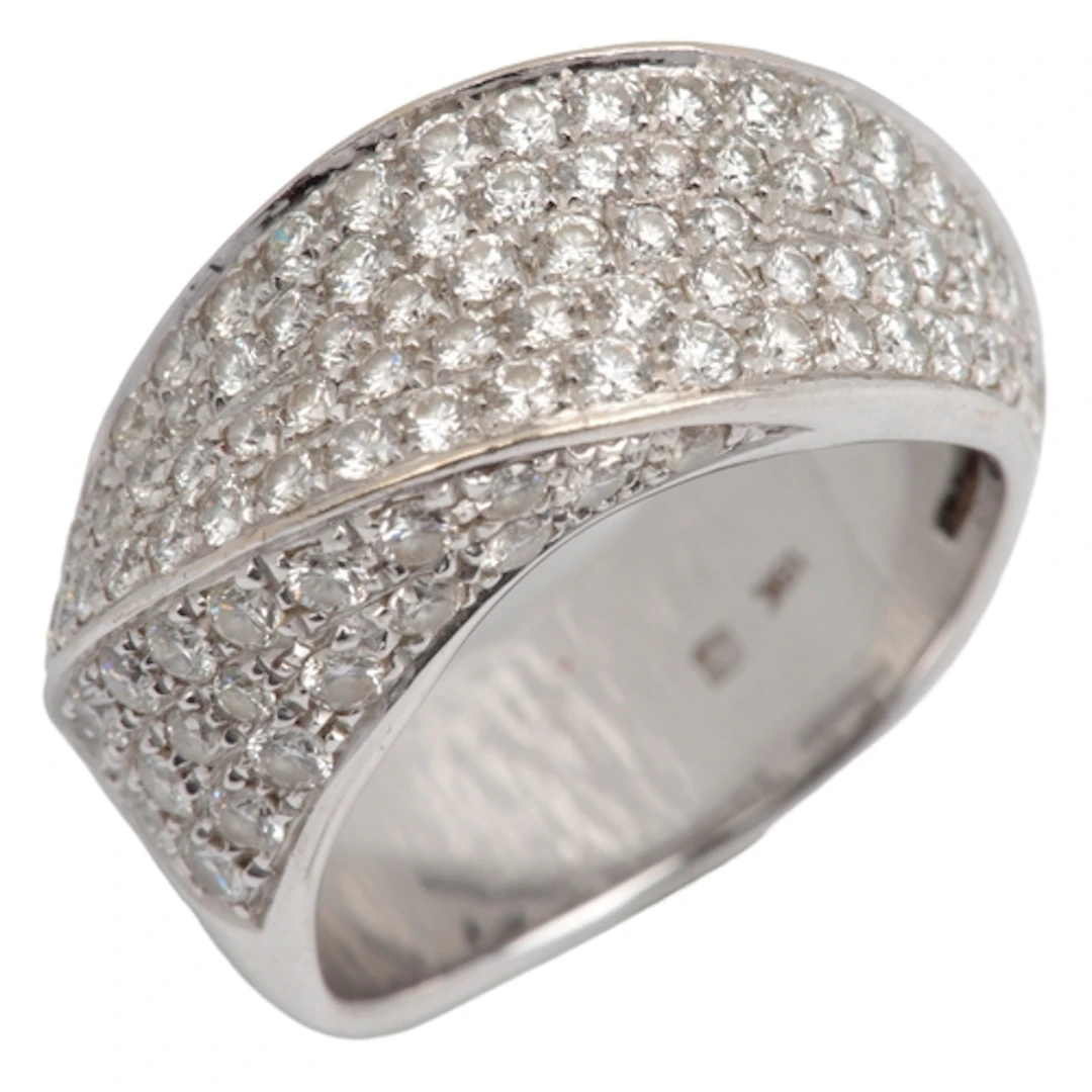 A diamond ring, the front of twist design, pavé-set with bri...