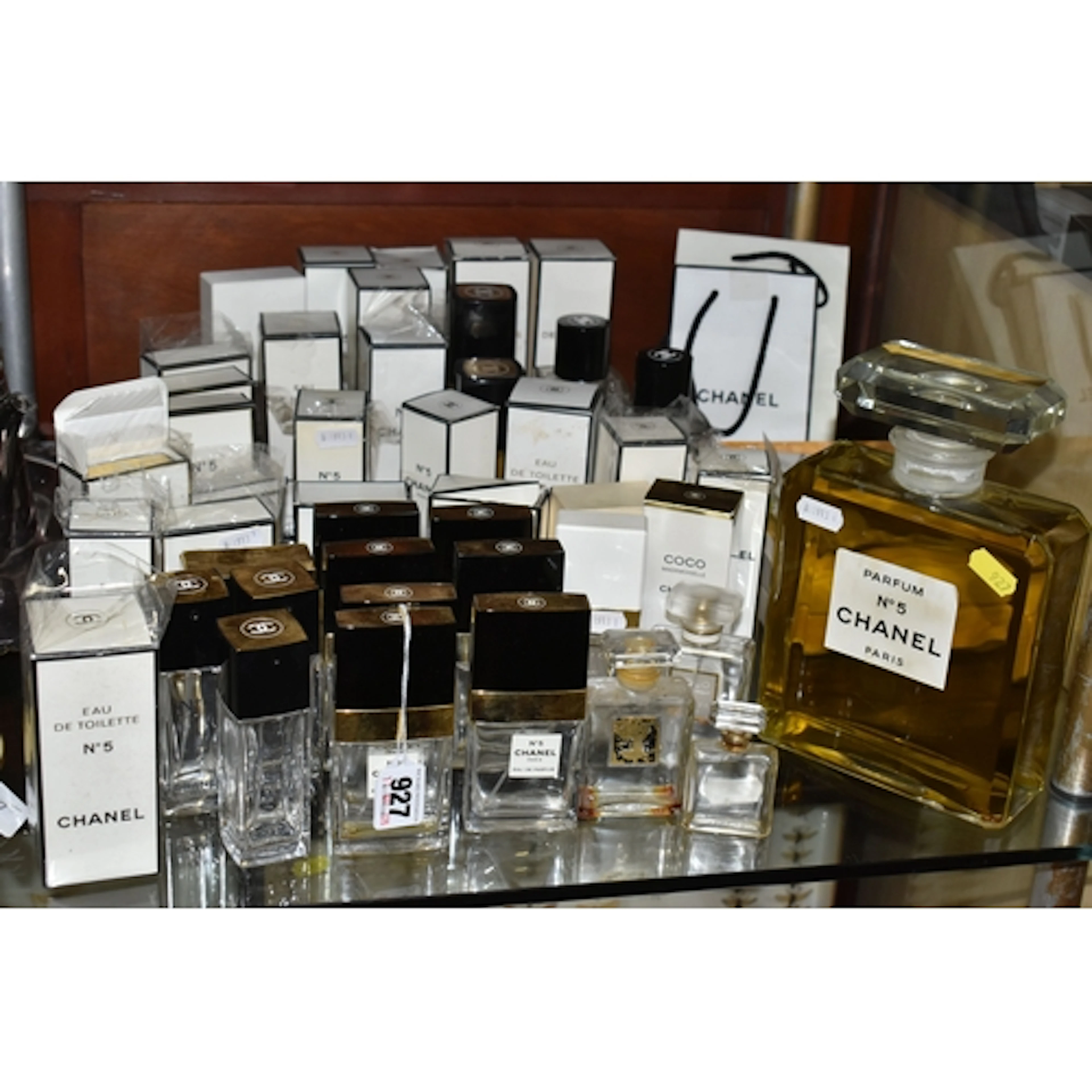 A COLLECTION OF EMPTY CHANEL PERFUME BOTTLES, ETC, to includ...