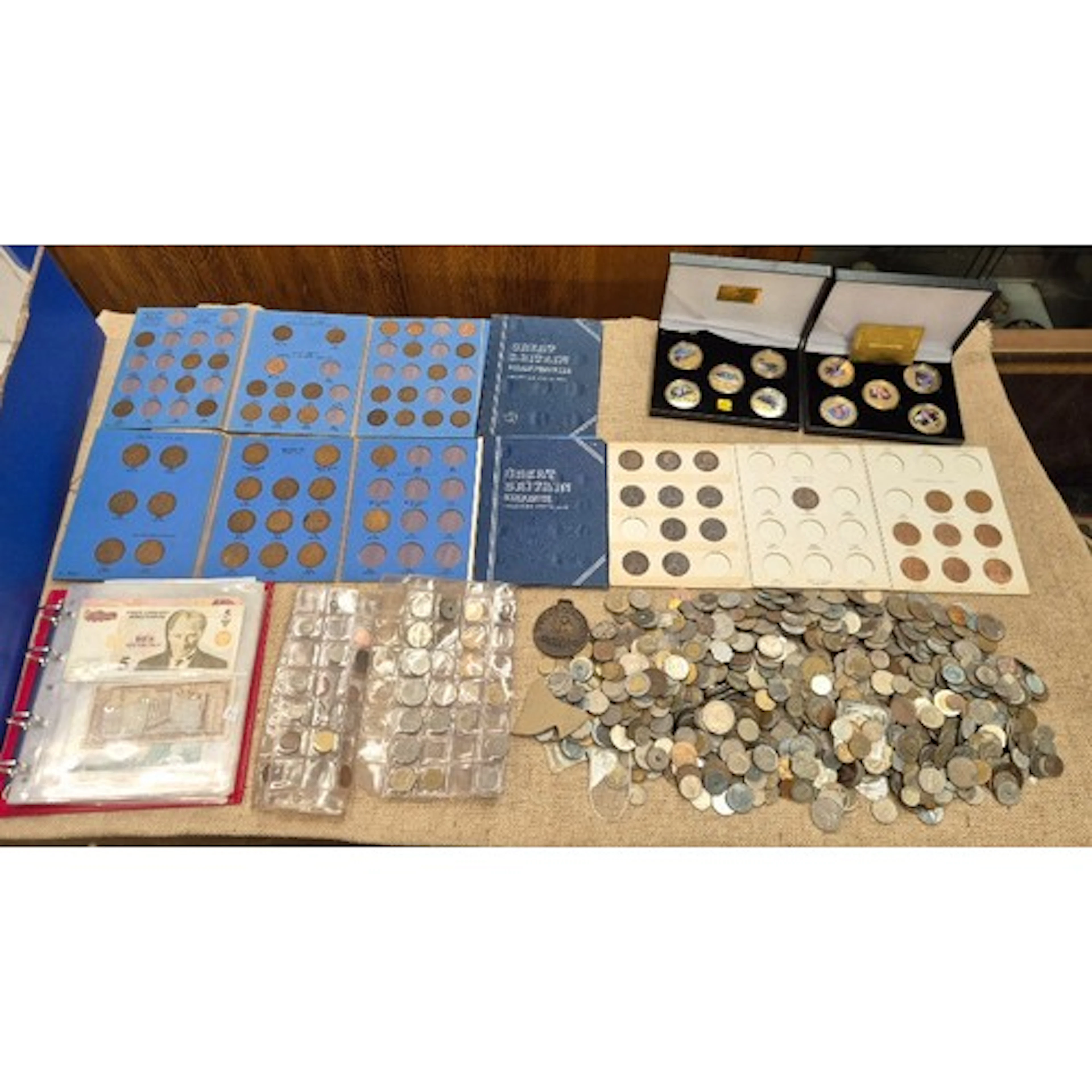 A box of assorted world coins & banknotes to include Whitman...