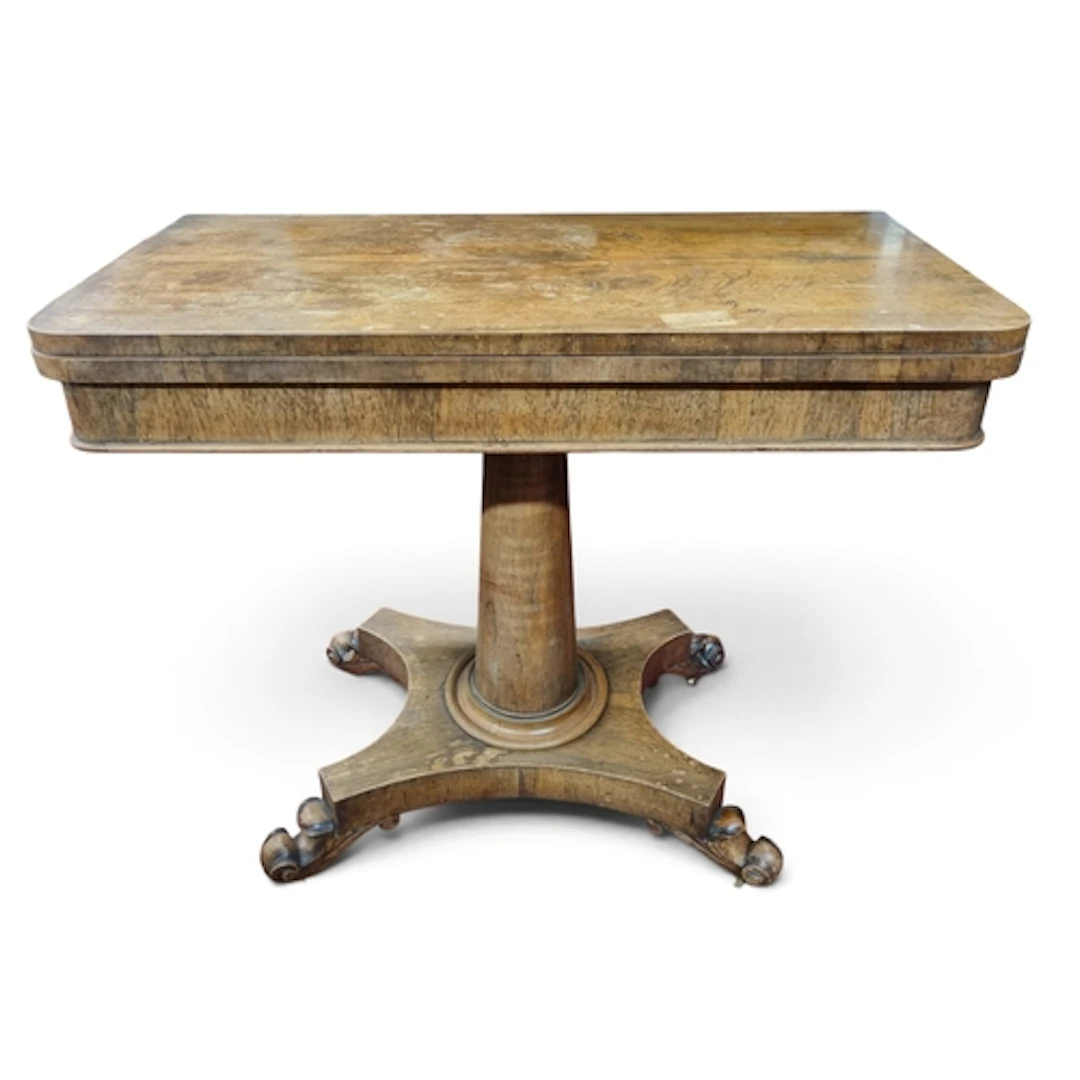 A 19th Century Rosewood foldover Card Table on pillared supp...
