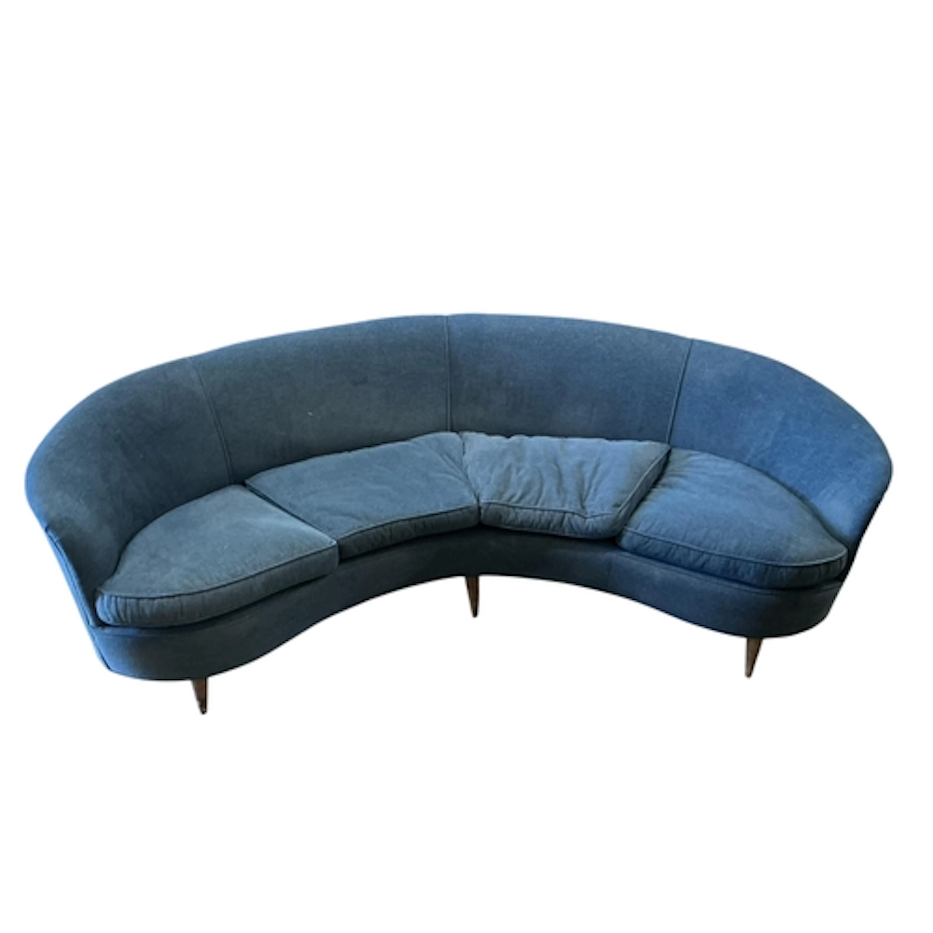 A mid century Italian upholstered curved sofa in the style o...