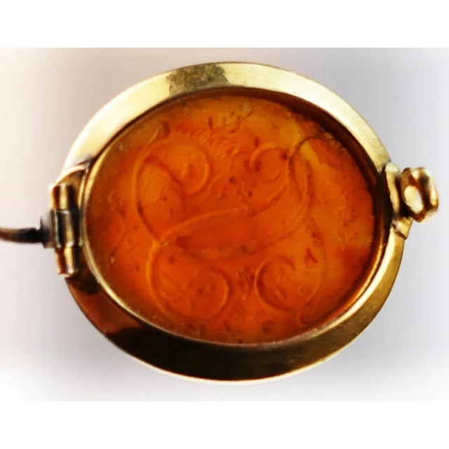 An antique carnelian set brooch in a high carat precious yel...