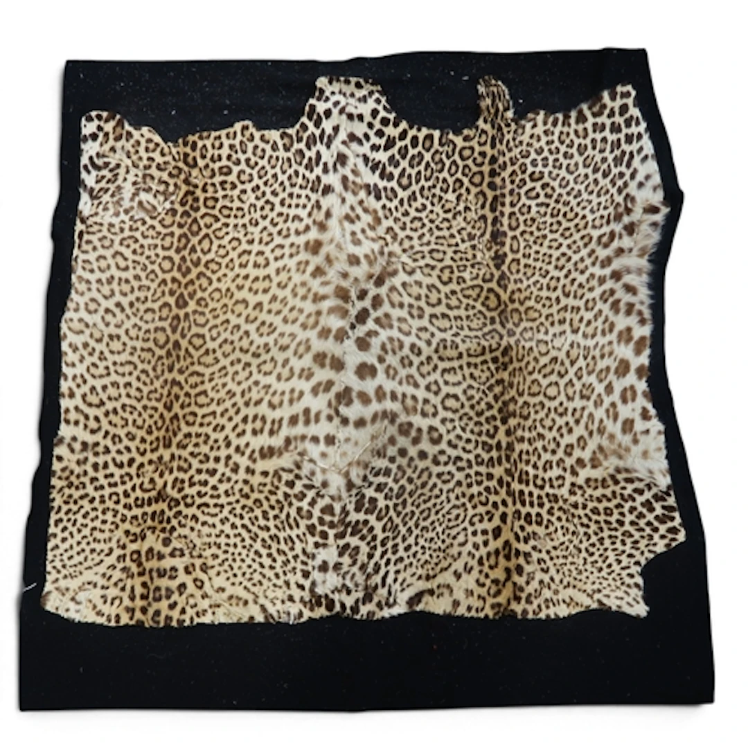 A leopard carriage rug with felt backing approx. 145cm x 1...