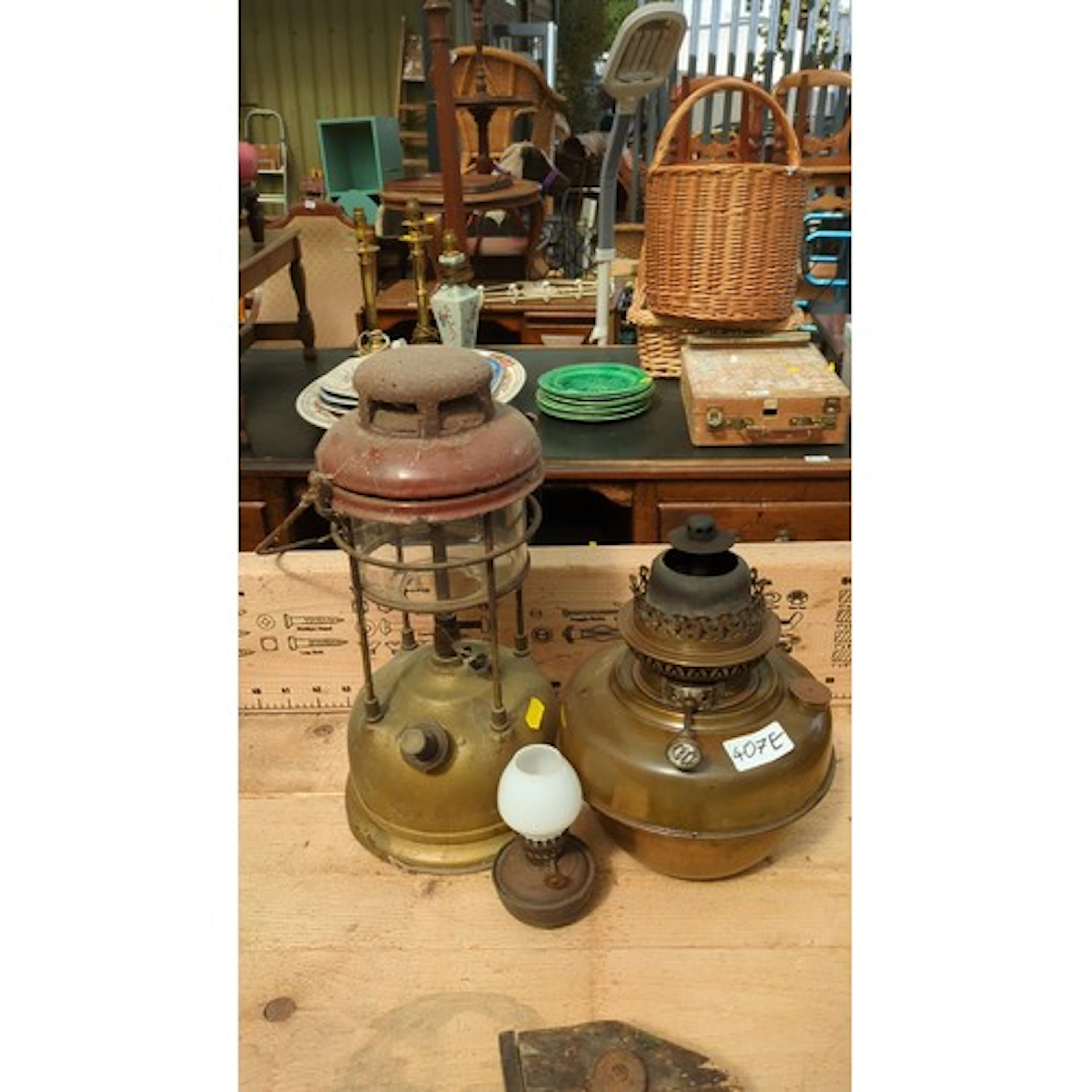 A group of vintage pressure and oil lighting, including a Ti...
