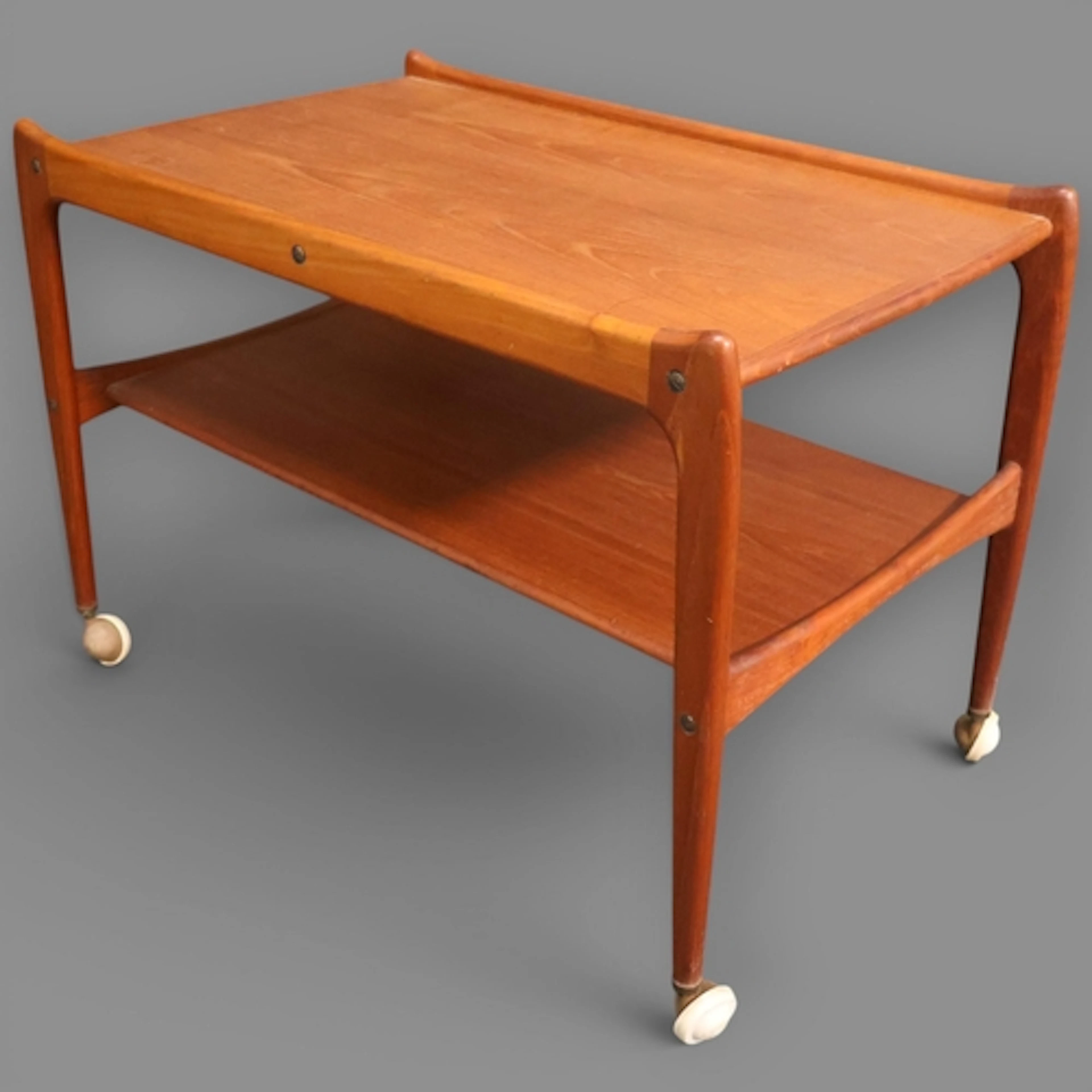 A Mid-Century Danish two tier teak Drinks/serving trolley by...