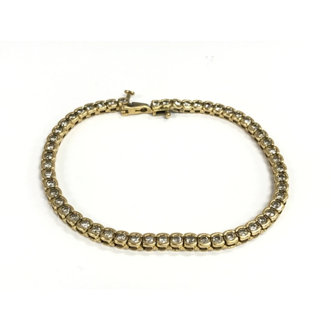 An 18ct gold diamond line bracelet. 20cm length. 15.38g