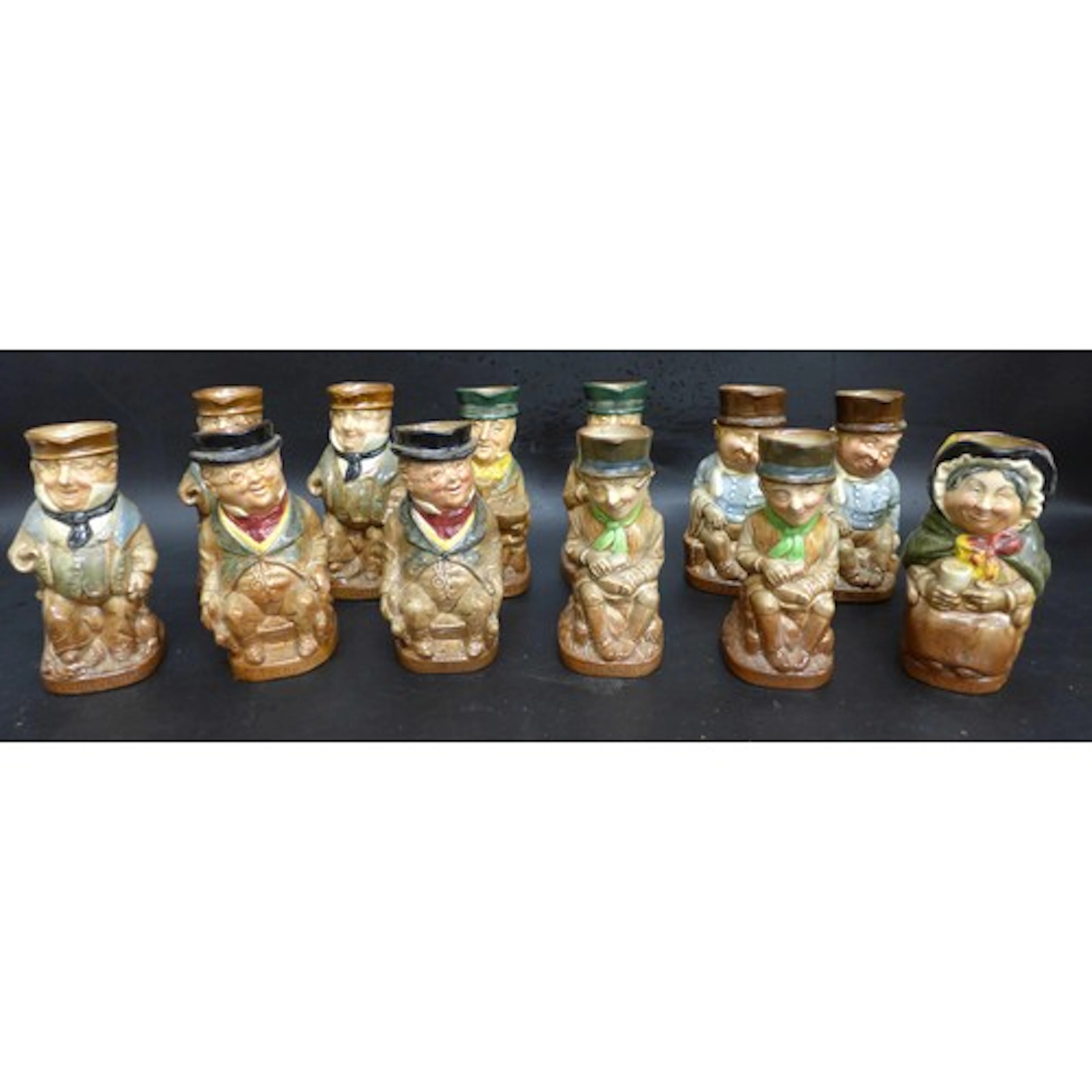 A collection of Charles Dickens character Toby Jugs, some du...