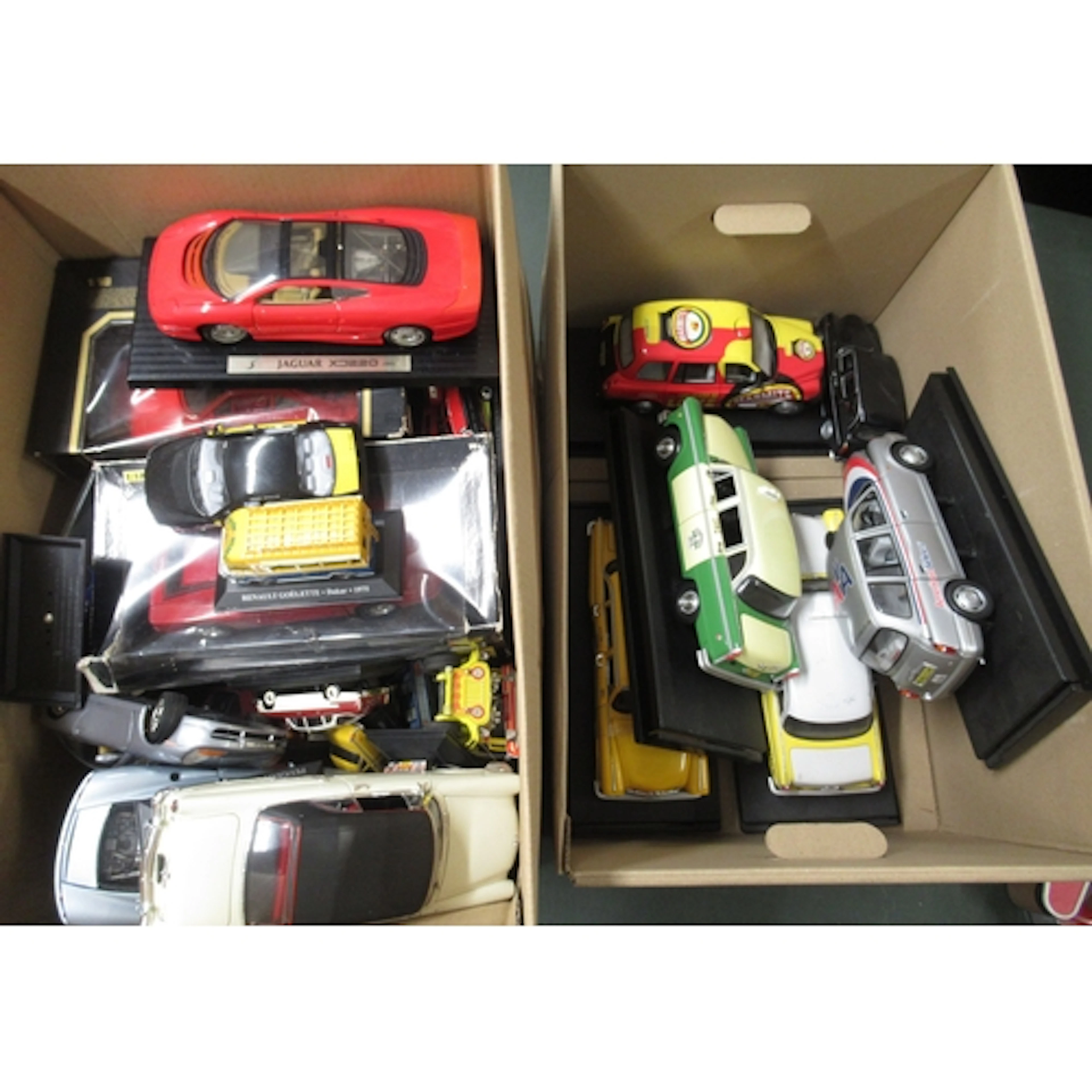 Two boxes containing a quantity of various model cars