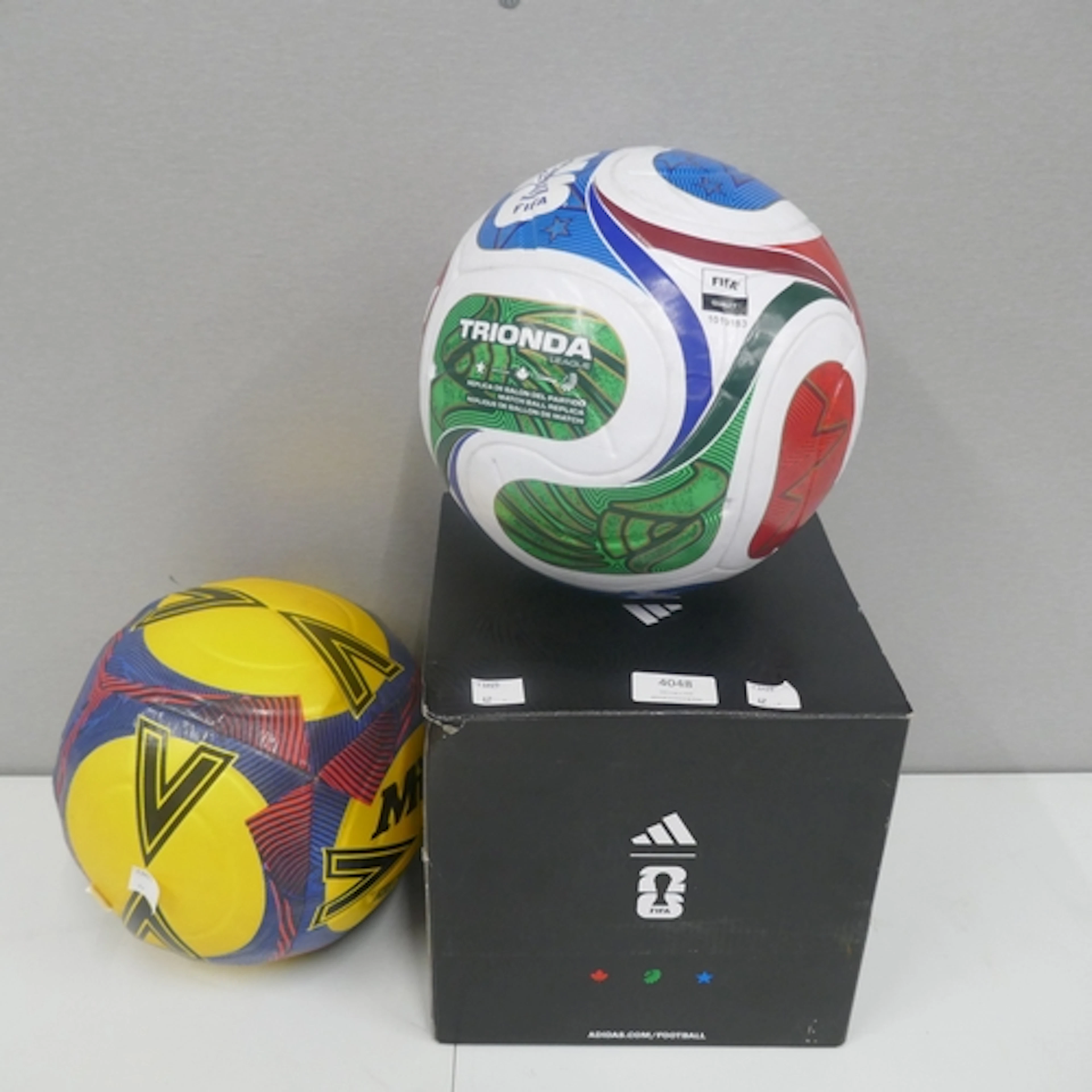 A mitre size 5 football and a world cup trionda replica ball...
