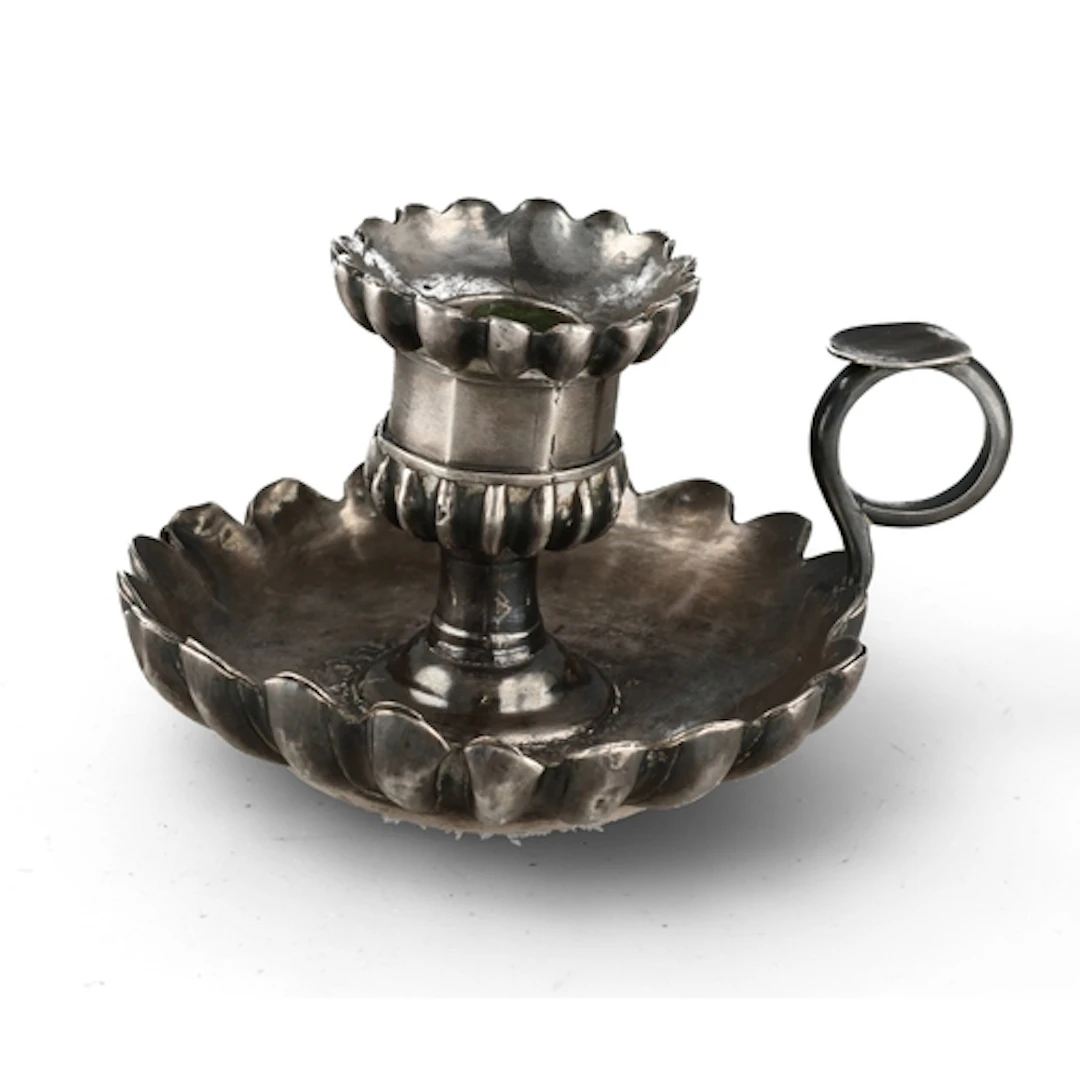 A SILVER CHAMBERSTICK Weight: 243gms