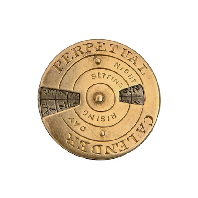 A gold and steel perpetual calendar, late 19th c, 21cm diam,...