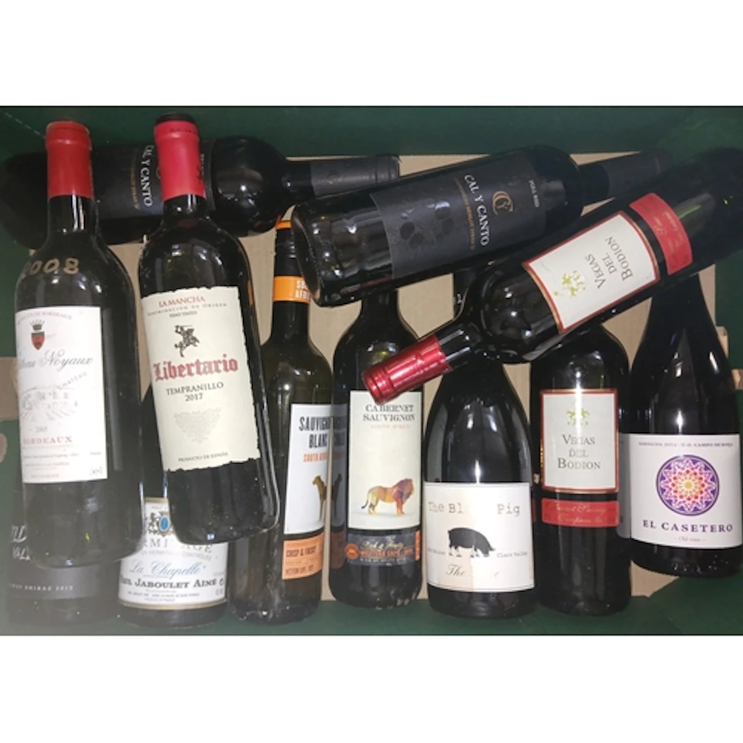 Four boxes of assorted red wines.
