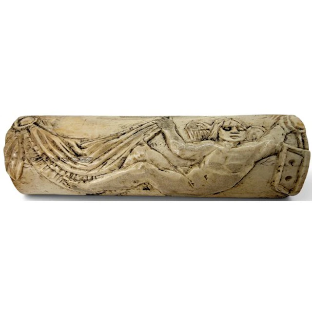 A Roman carved bone figural plaque depicting a winged Eros E...