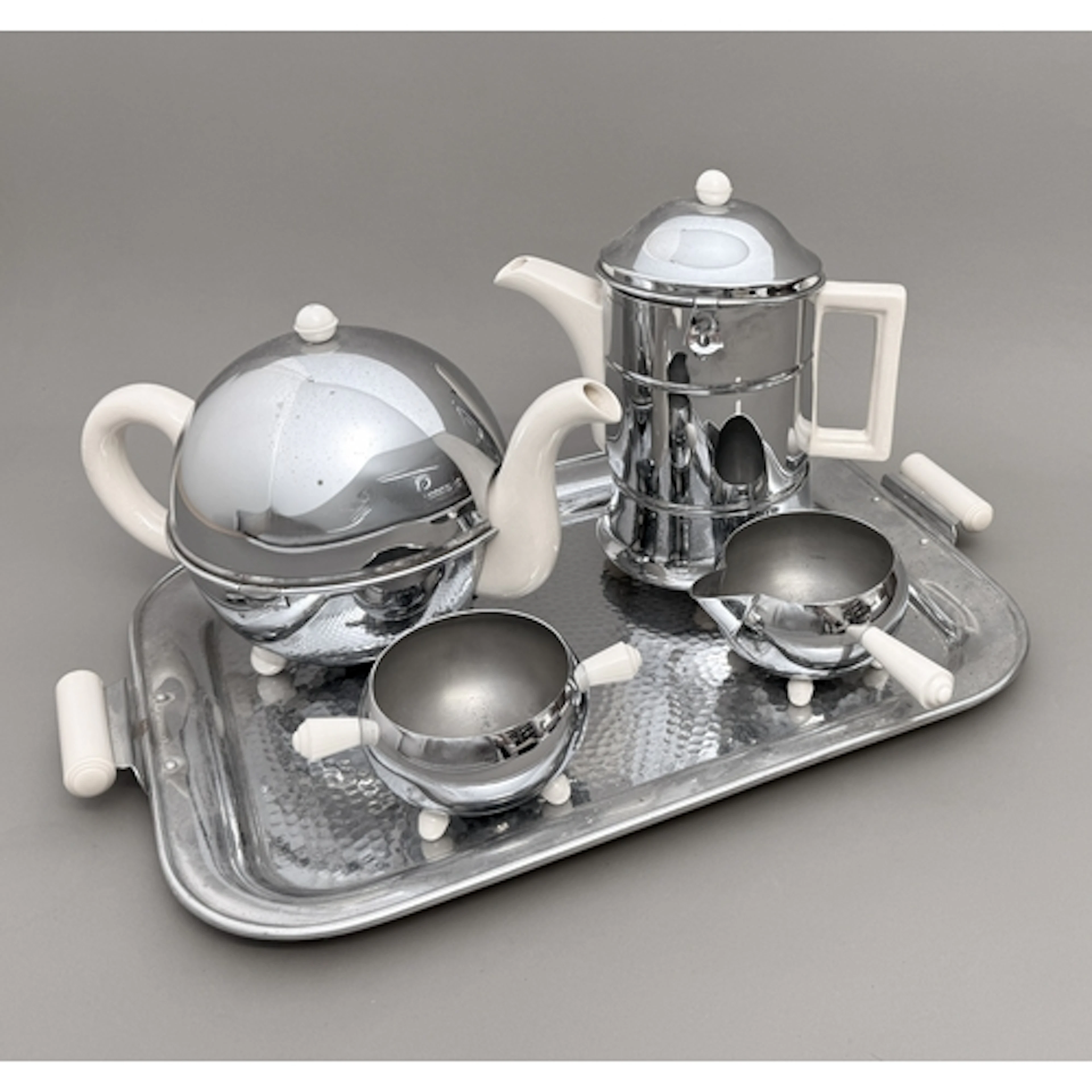 An Everhot PBB cream ceramic and chromium plate tea service ...