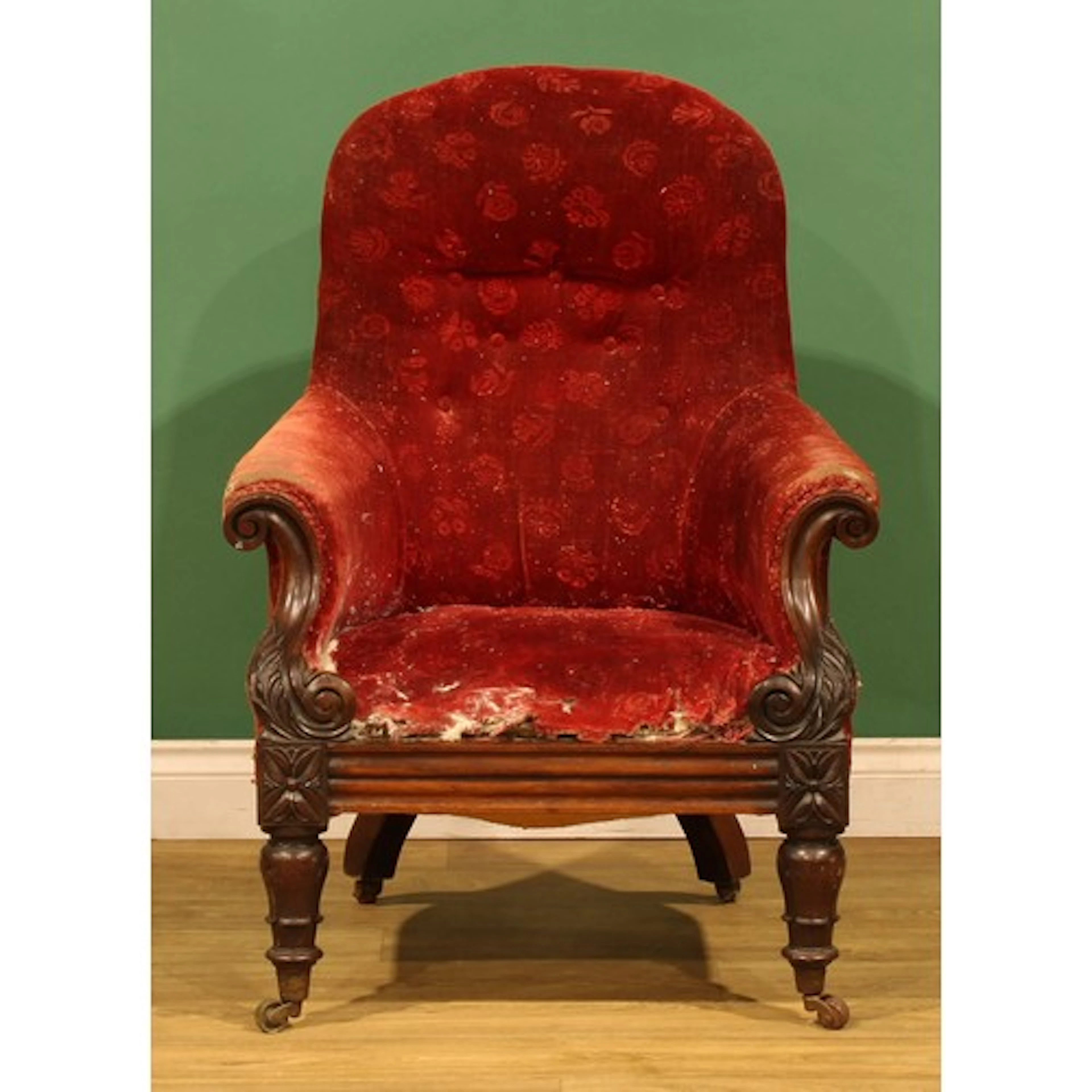 A William IV rosewood library chair, S-scroll arms carved wi...