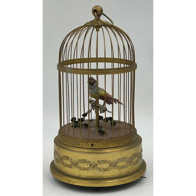 A French singing bird automaton in a domed gilt metal cage, ...