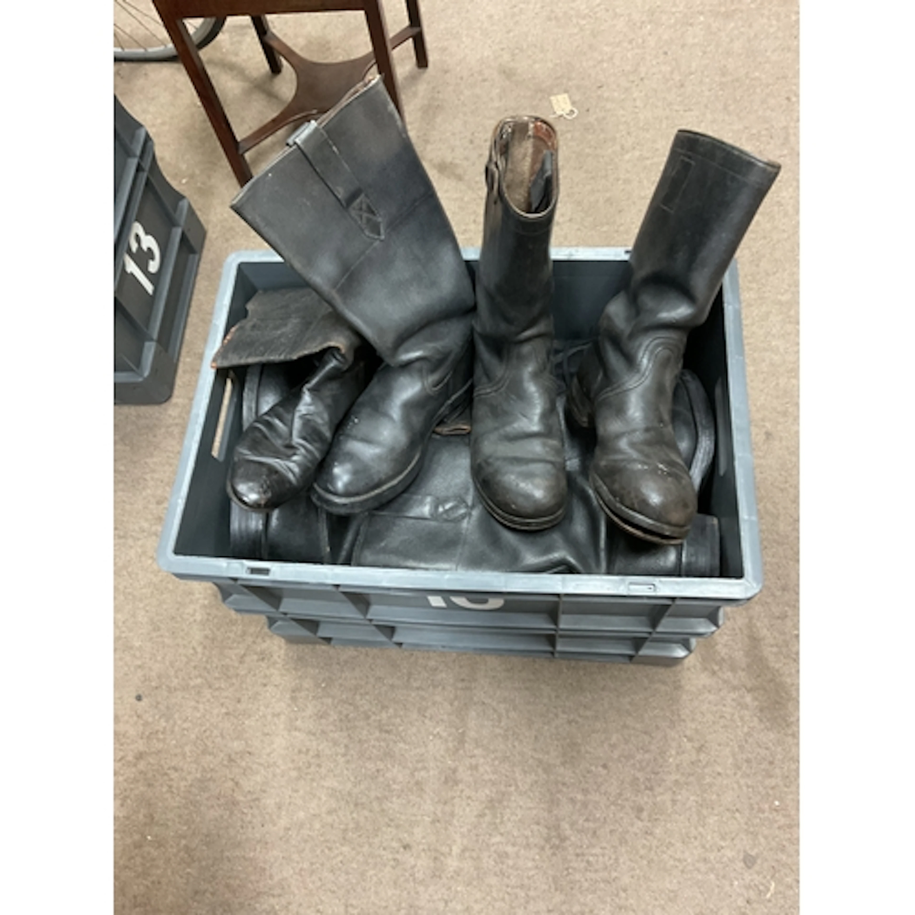 Crate of military black boots.