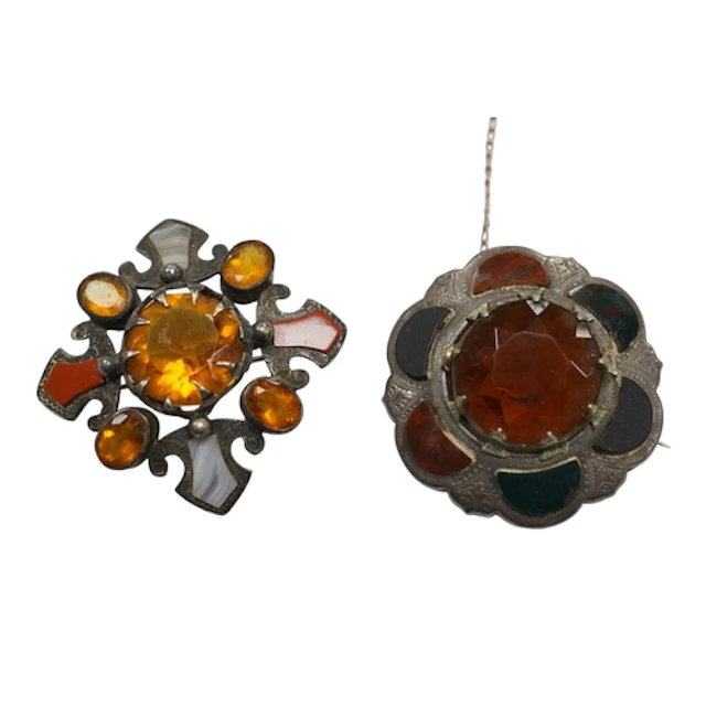 A sterling, Scottish hardstone and Cairngorm set shaped circ...