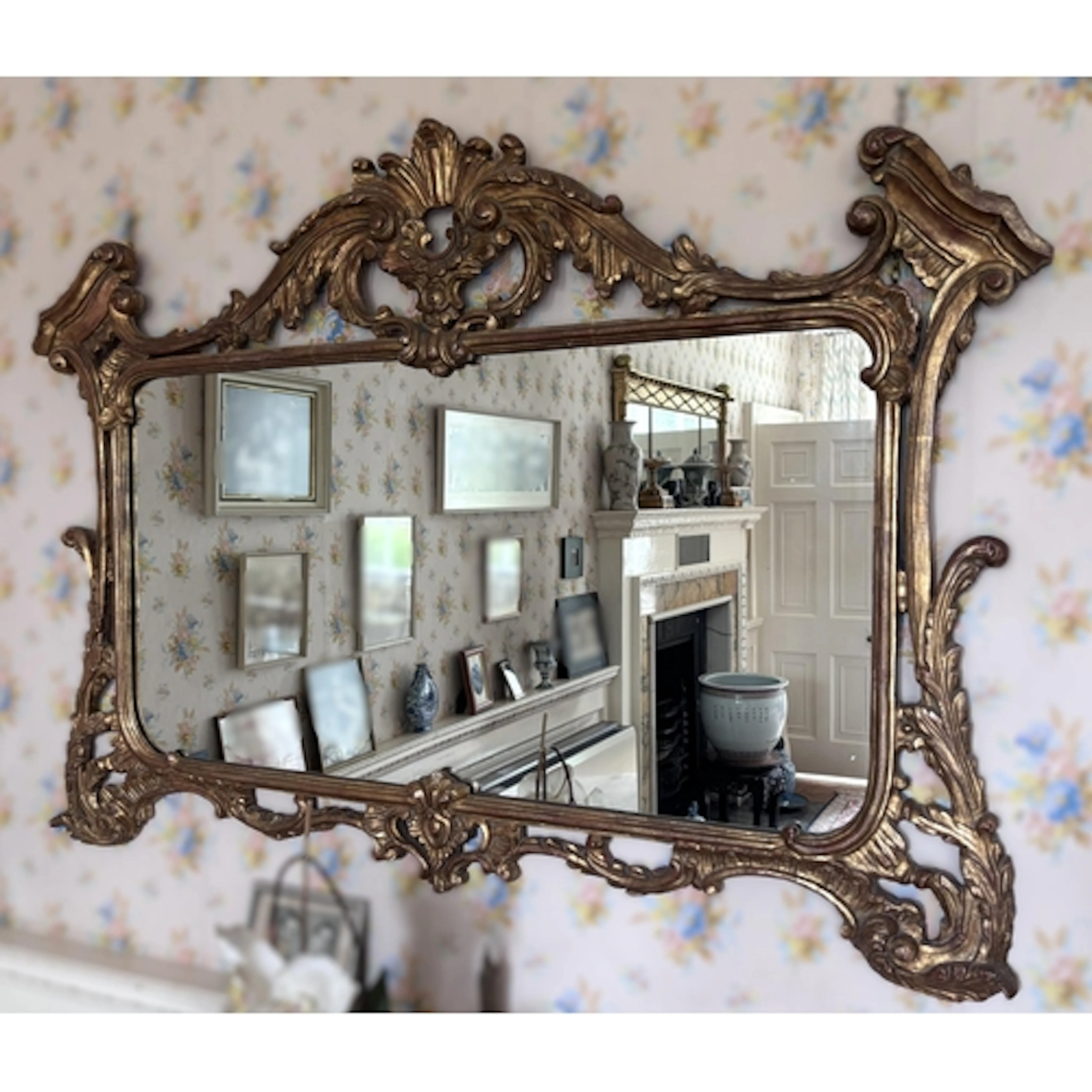 A George III giltwood overmantel mirror, in the manner of Th...