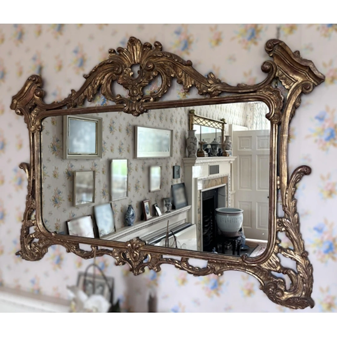 A George III giltwood overmantel mirror, in the manner of Th...