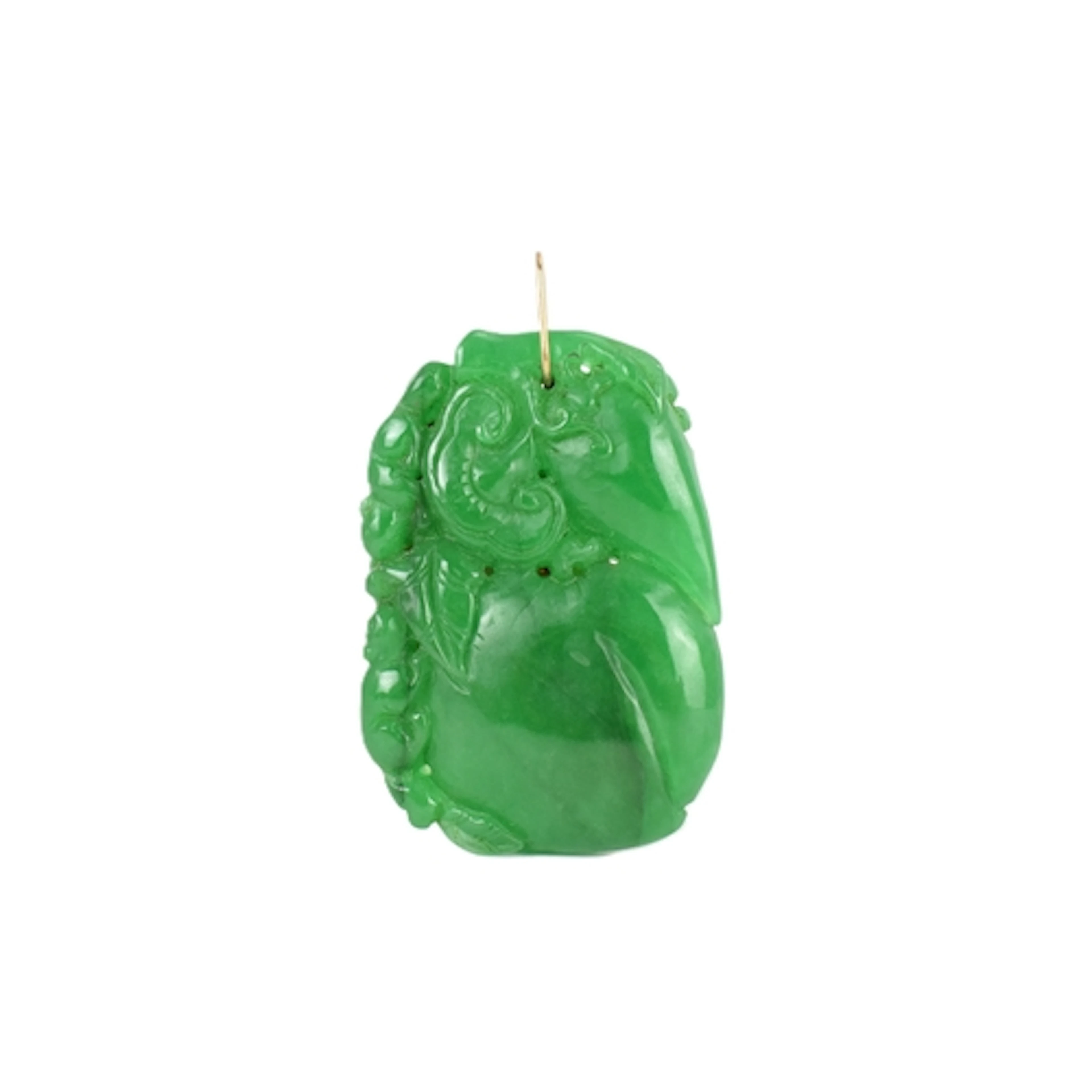A Chinese green jadeite pendant, carved in relief to both si...