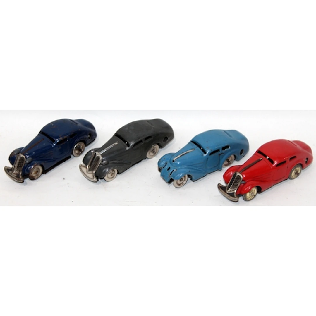 A small collection of four vintage Schuco tinplate wind up c...