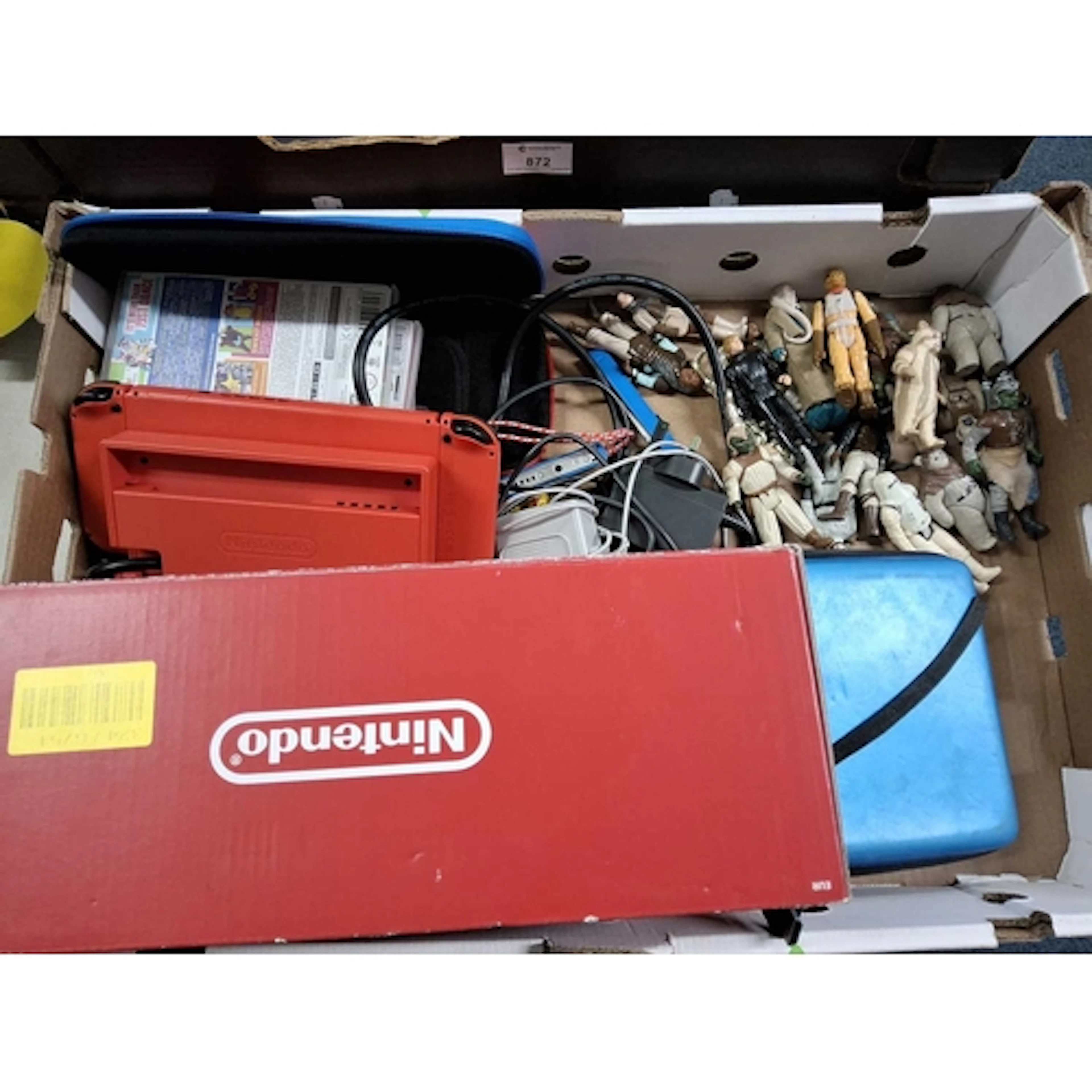 A BOX OF NINTENDO VIDEO GAME CONSOLES AND STAR WARS ACTION F...