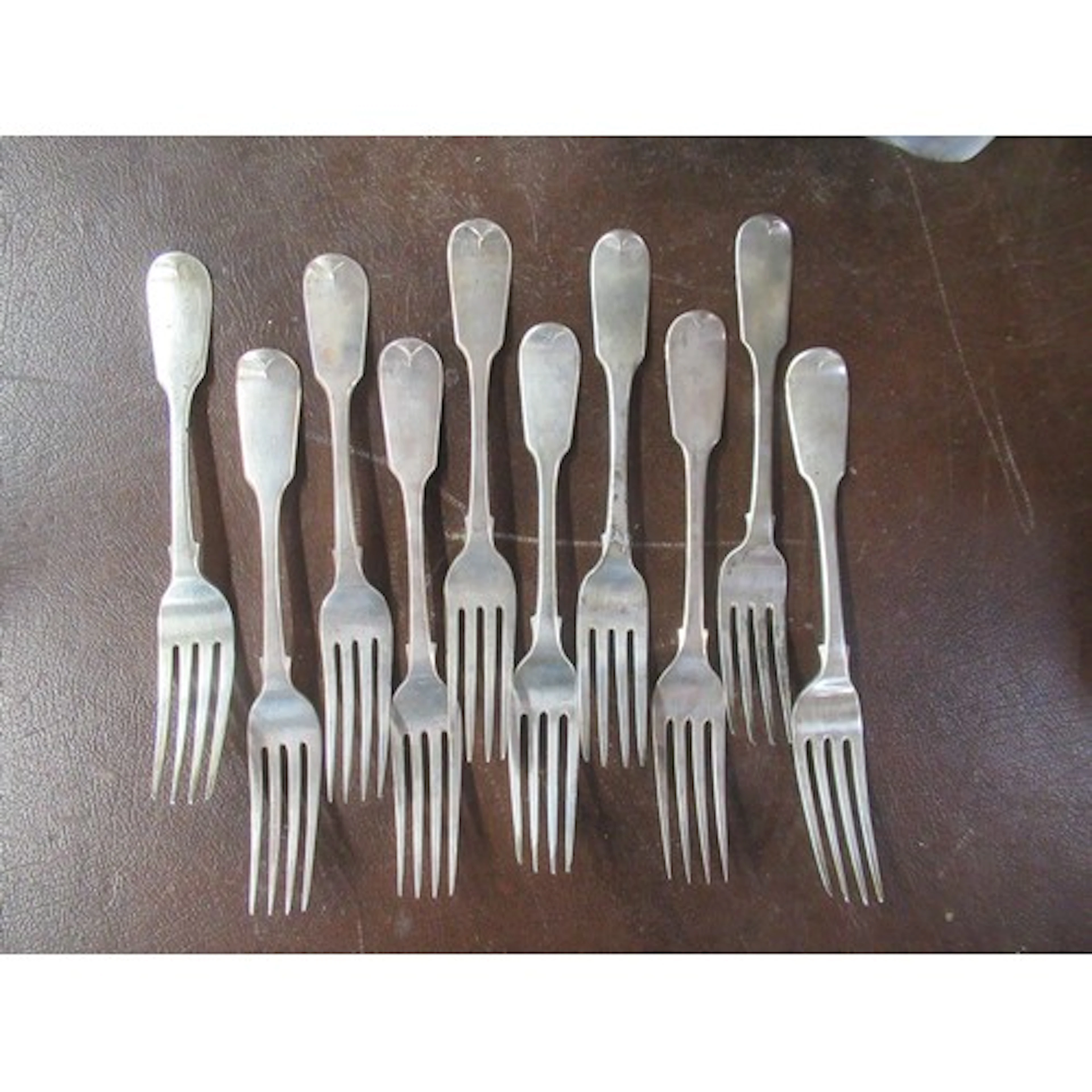 10 various 19th century silver fiddle pattern dinner forks, ...