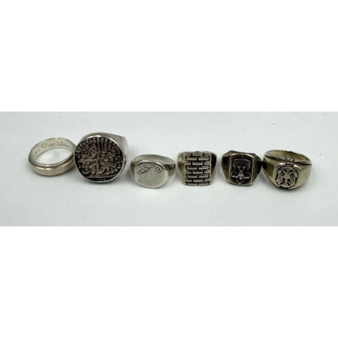 A selection of six silver Gents rings, varying styles and de...