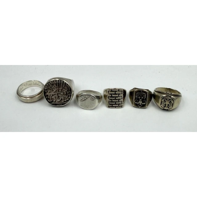 A selection of six silver Gents rings, varying styles and de...