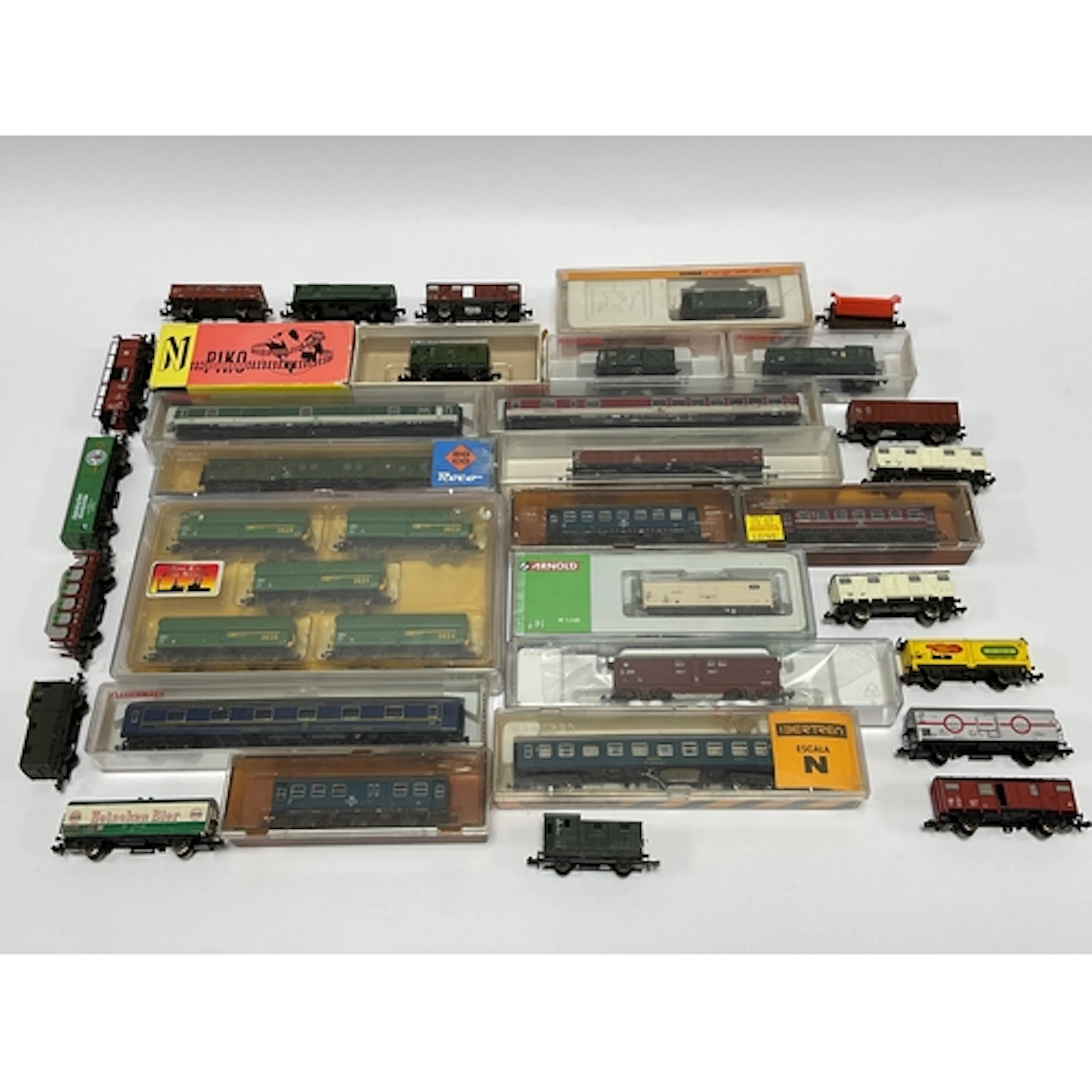 Approximately thirty-five N gauge European wagons and coache...