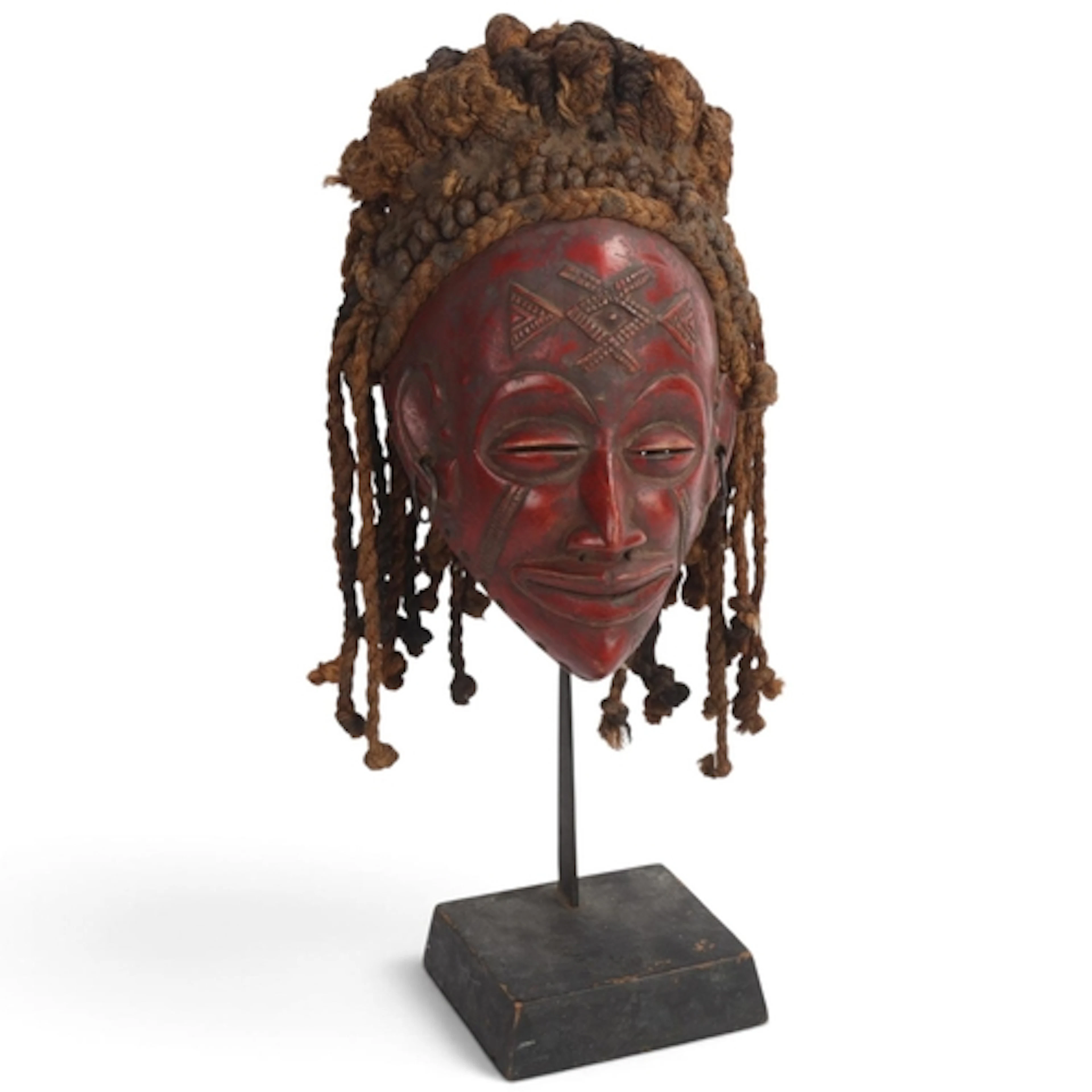 A Chokwe Tribal mask, Congo, carved and painted wood with wo...