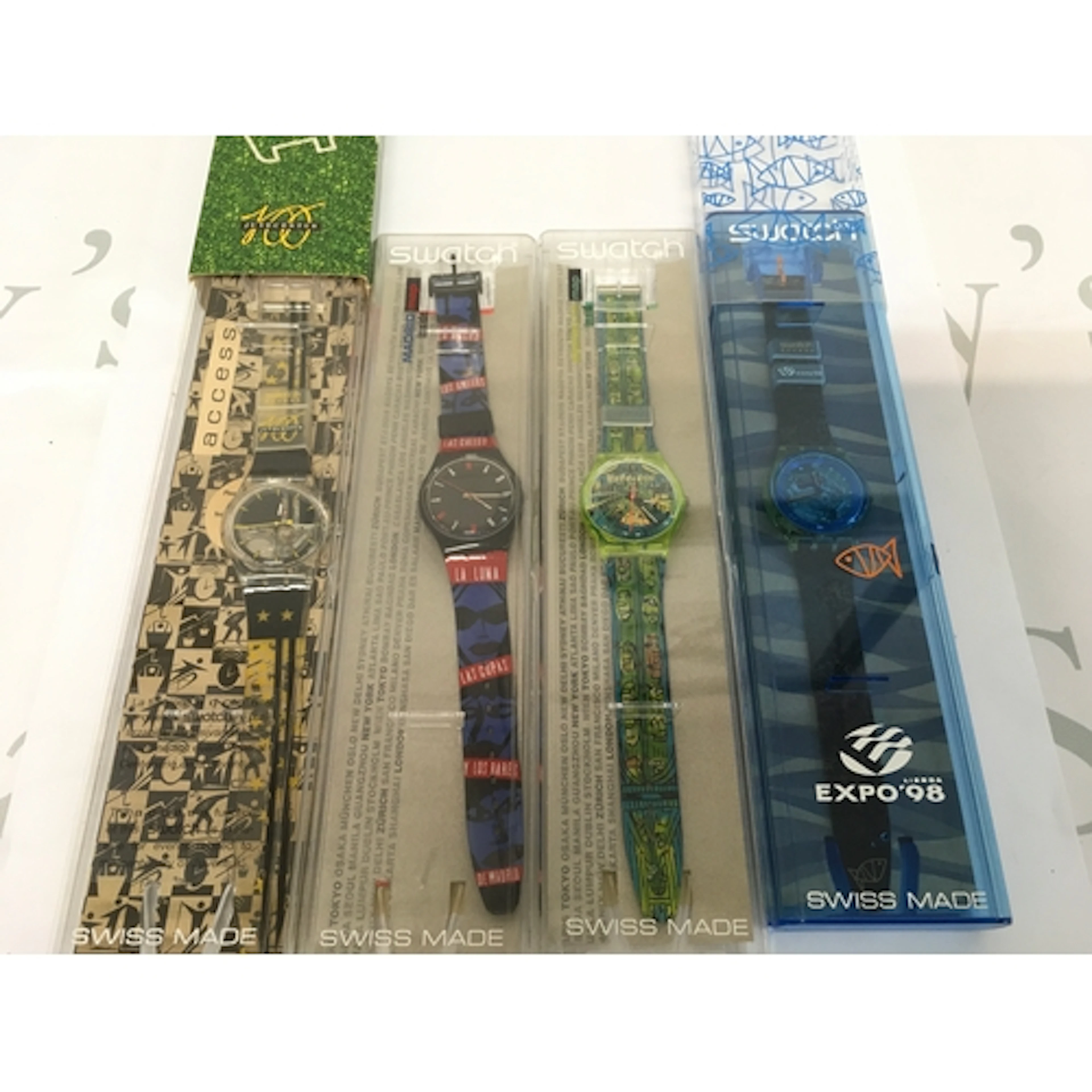 A collection of four vintage Swatch watch is the "Sueno...