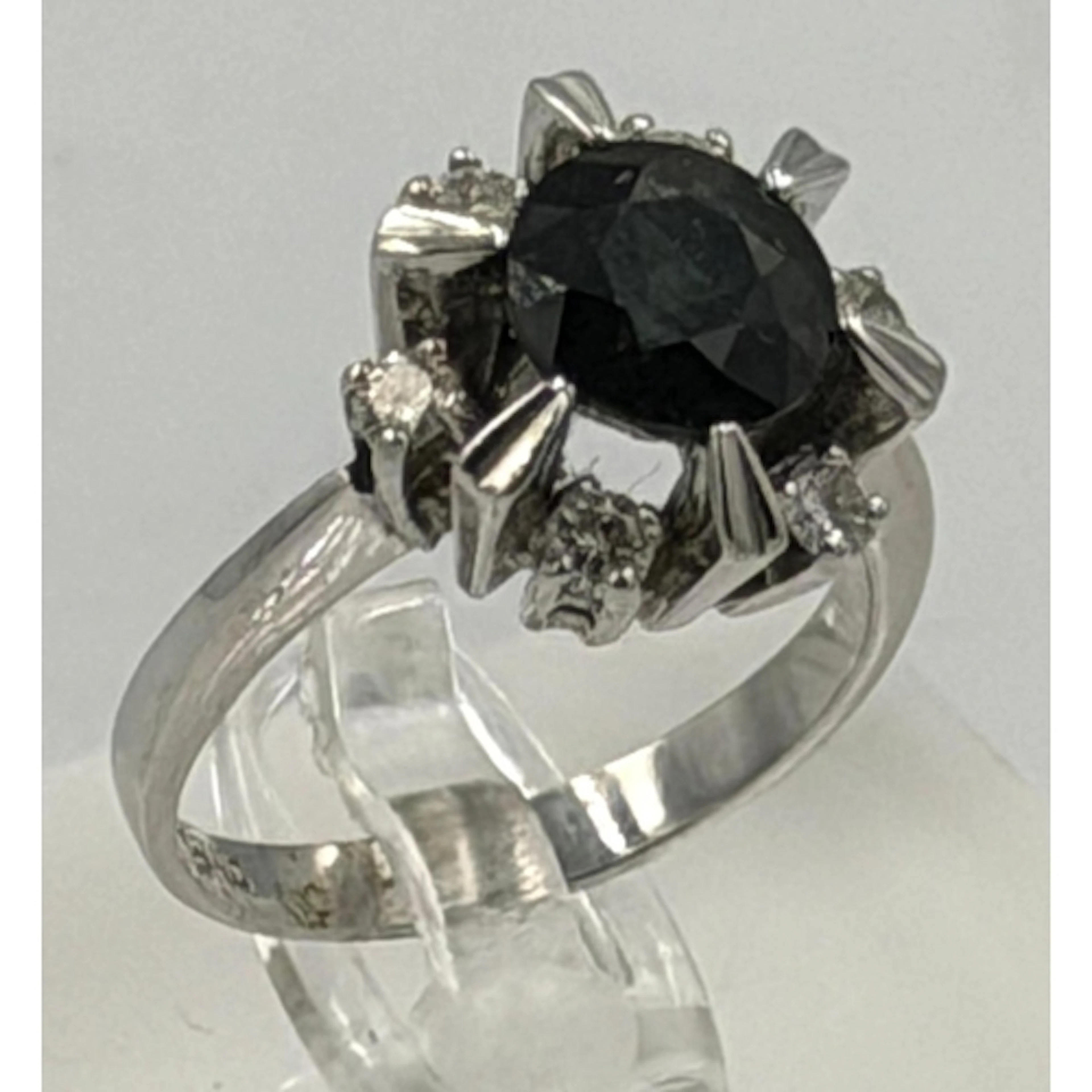 An 18ct white gold sapphire and diamond ring, approximate si...