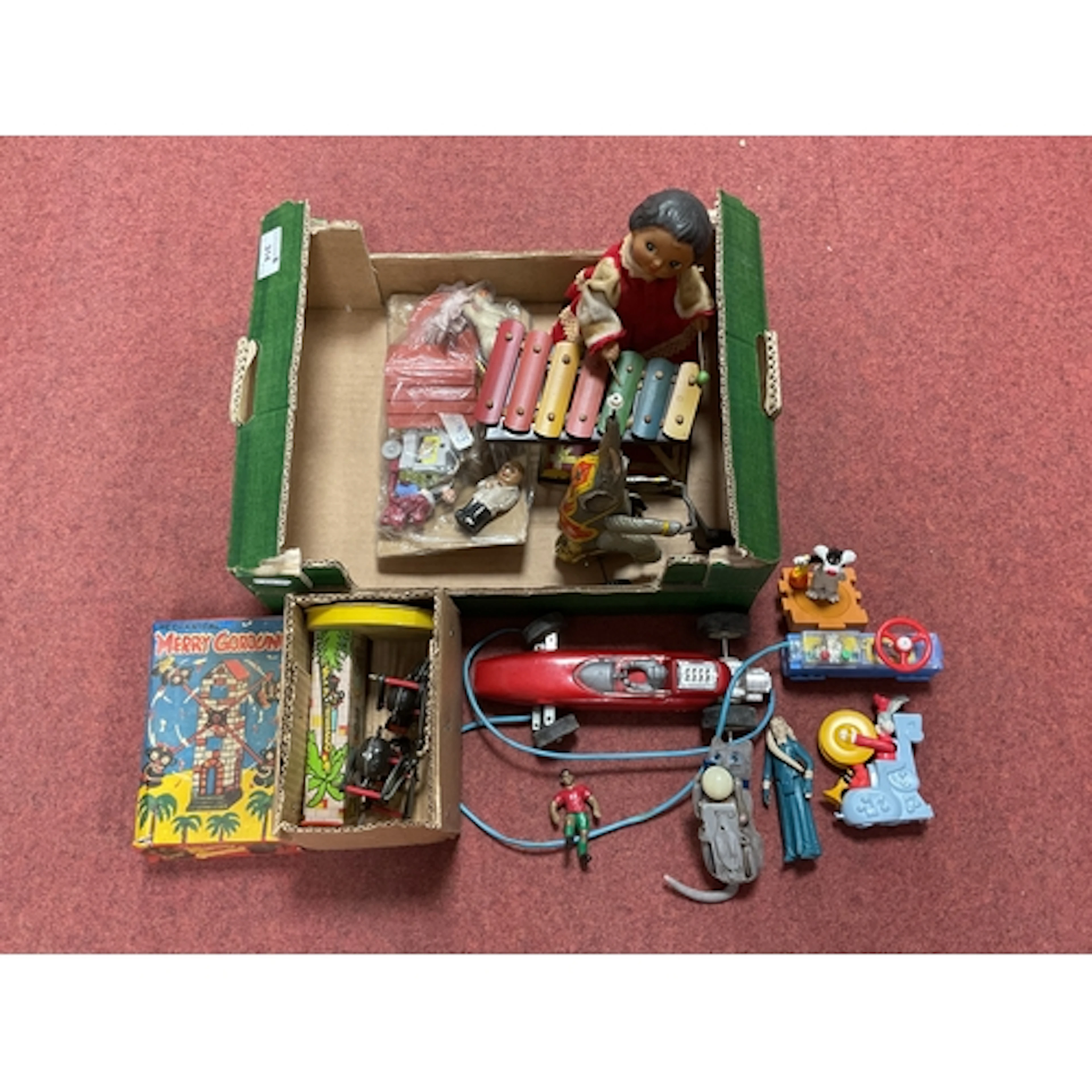 A small quantity of modern tinplate novelty wind up toys, Pl...