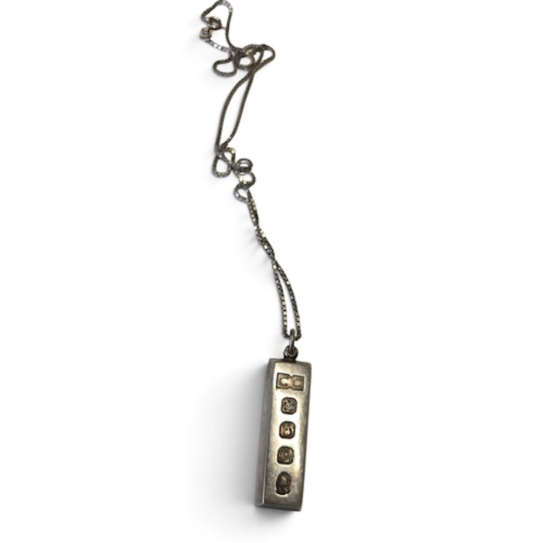 A Silver 1oz Ingot and chain.