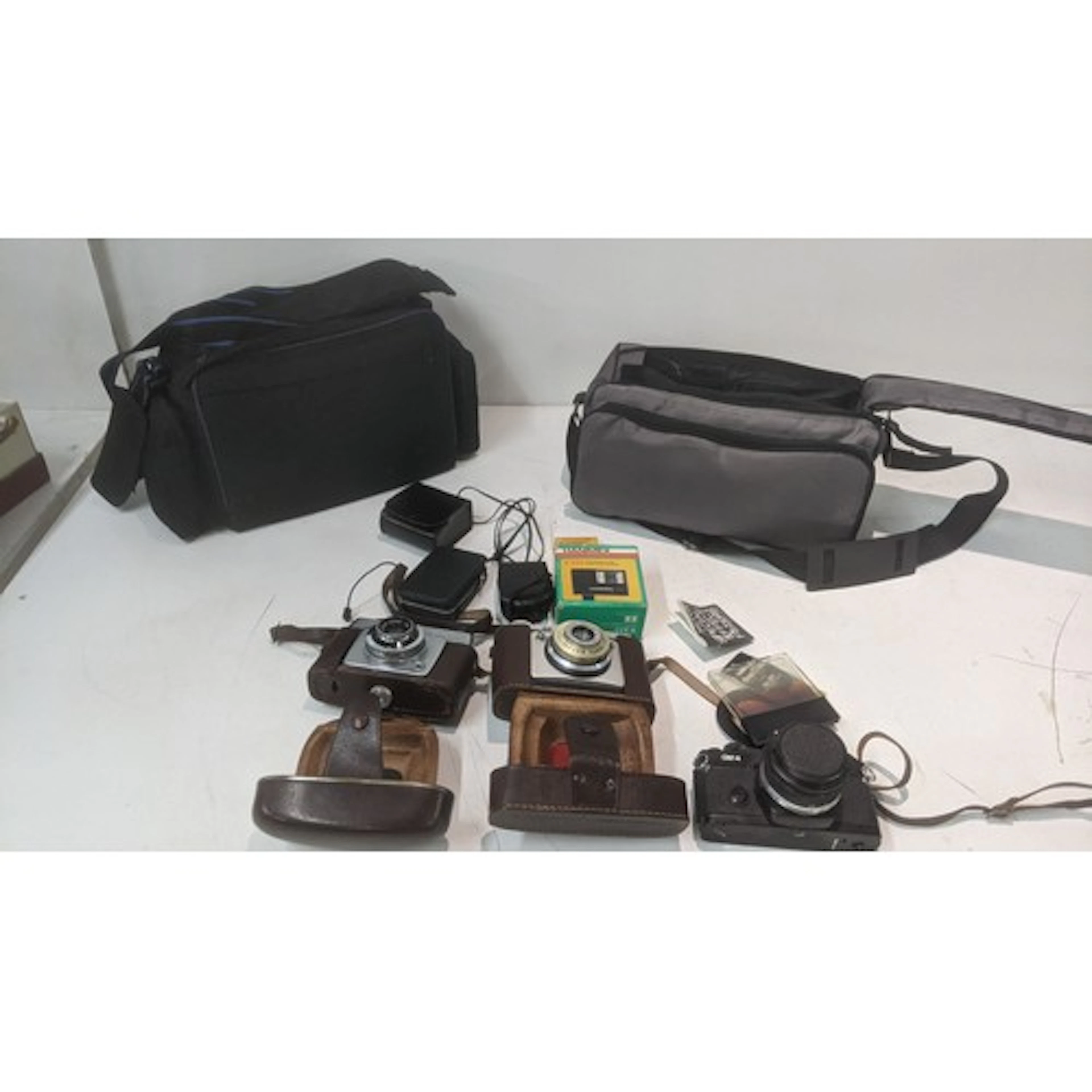 Photographic equipment to include an Olympus OM-4 camera and...