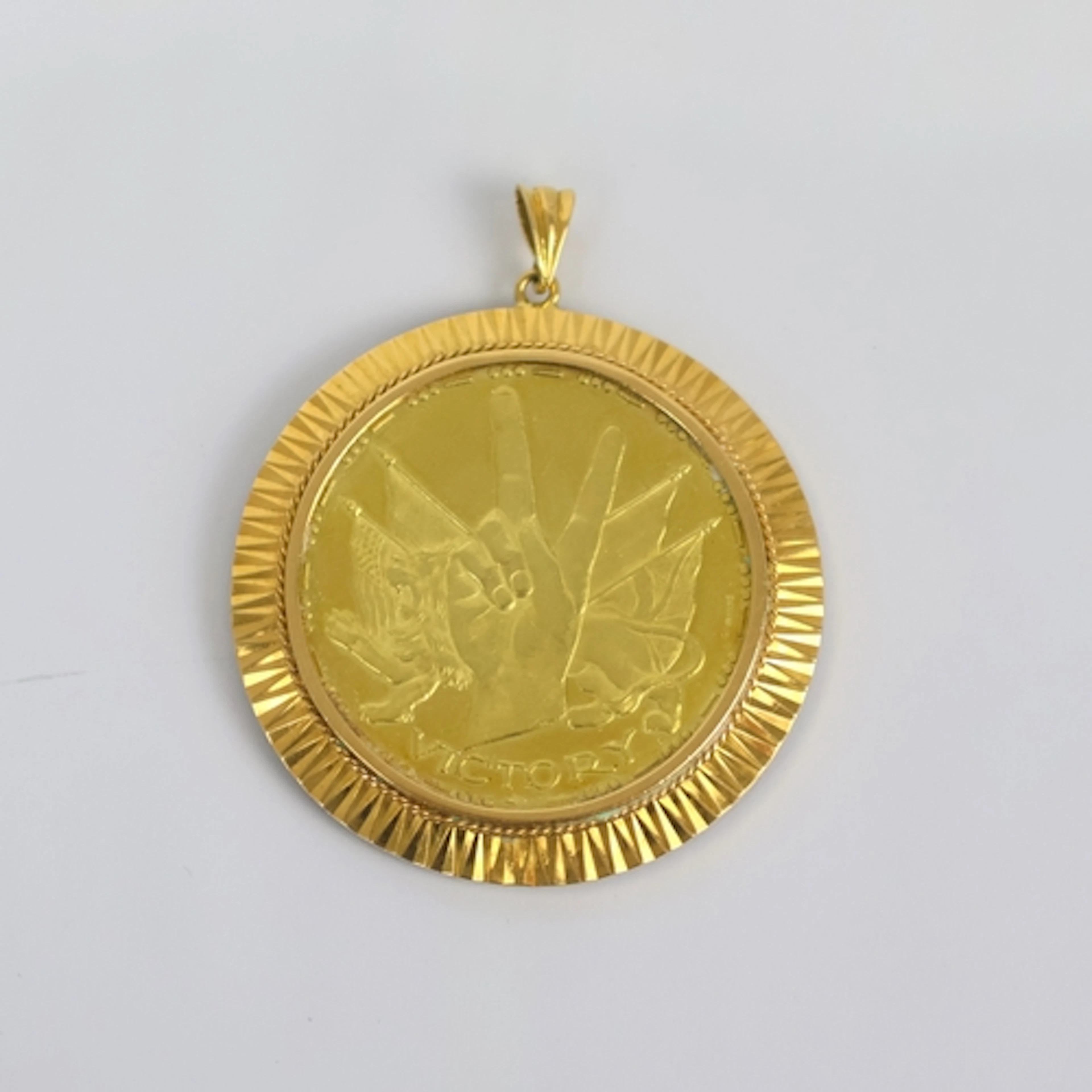A yellow metal mounted Sir Winston Churchill 18ct yellow gol...